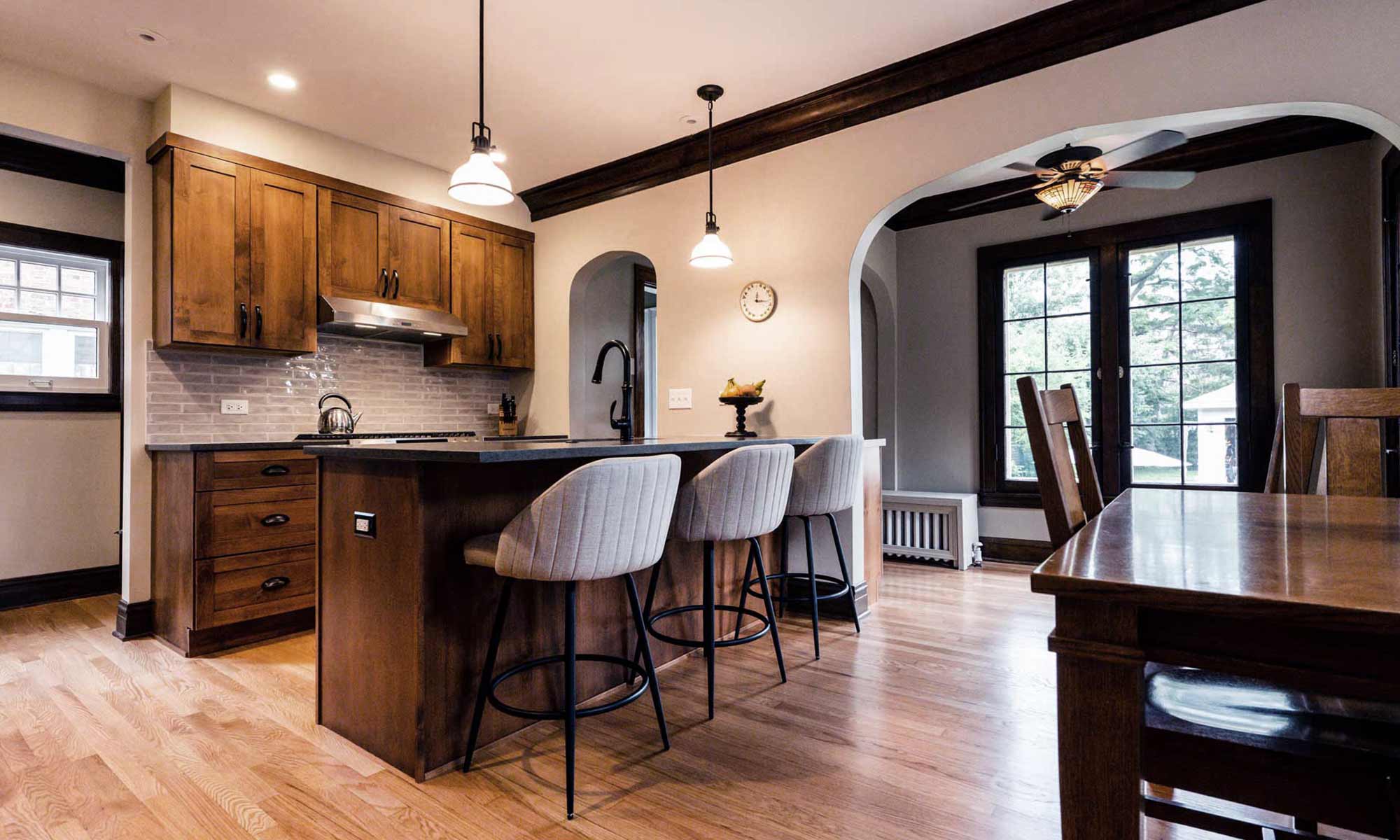 dark wood kitchen cabinets with peninsula seating