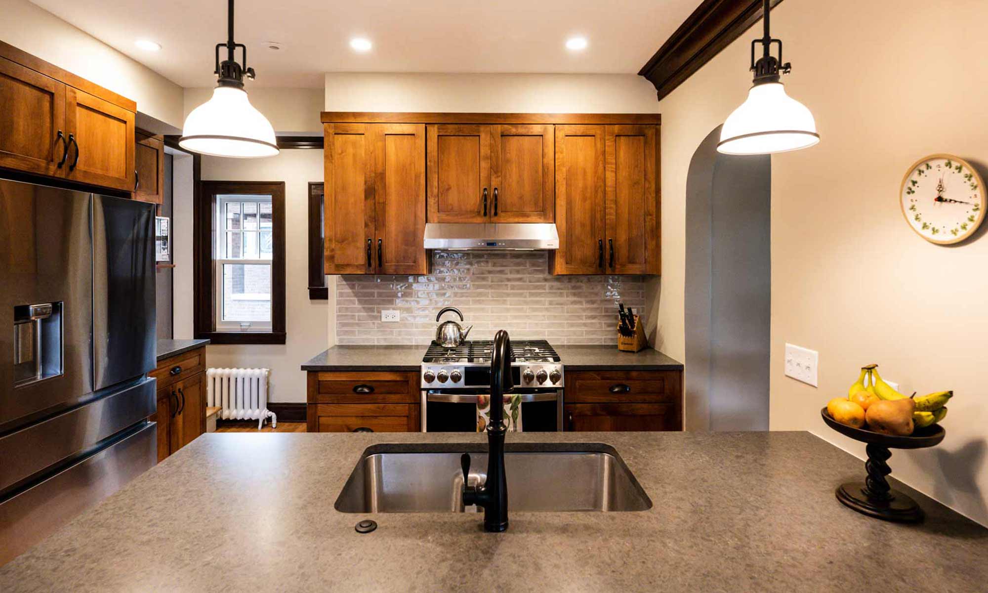 dark wood kitchen cabinets with peninsula seating