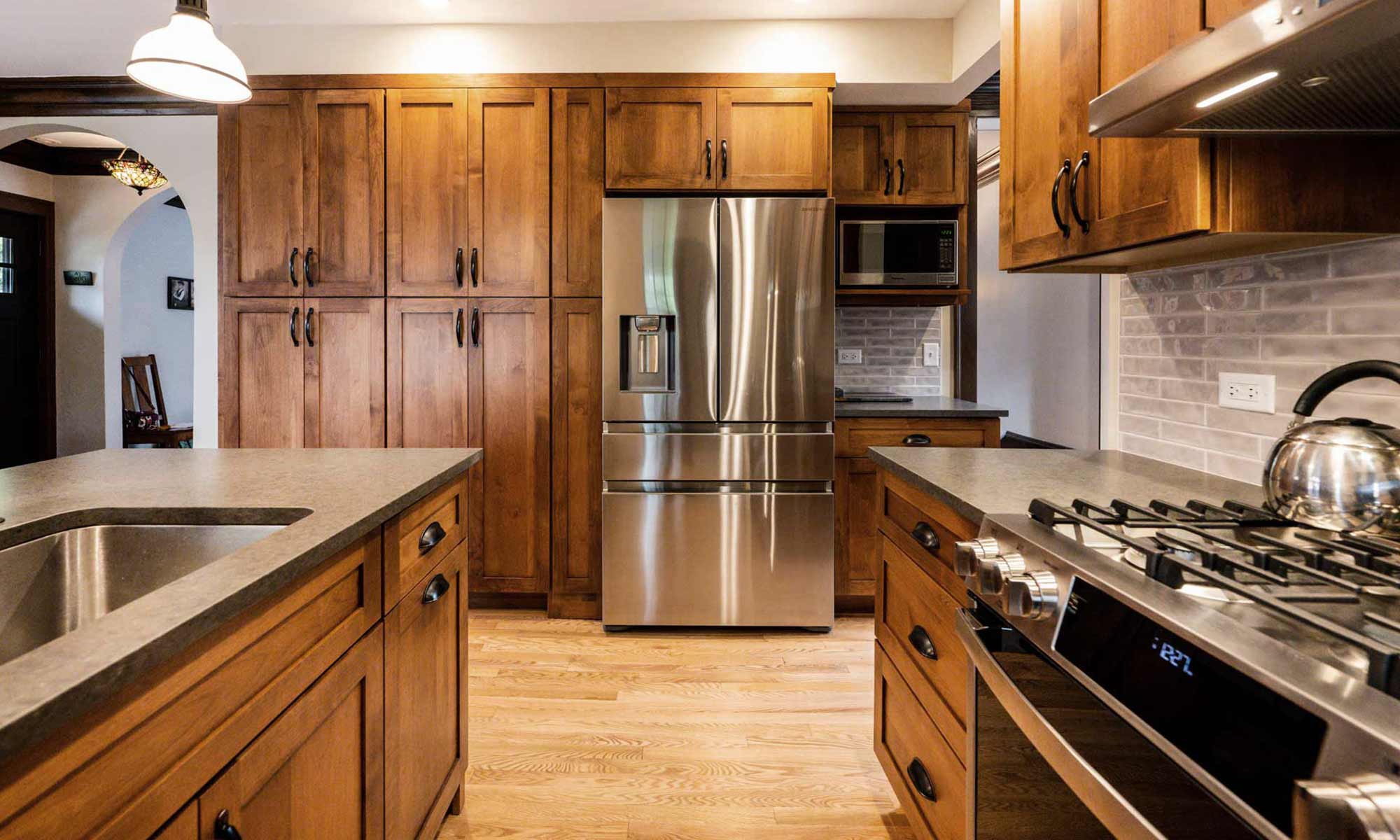 dark wood kitchen remodel view of stainless steel fridge