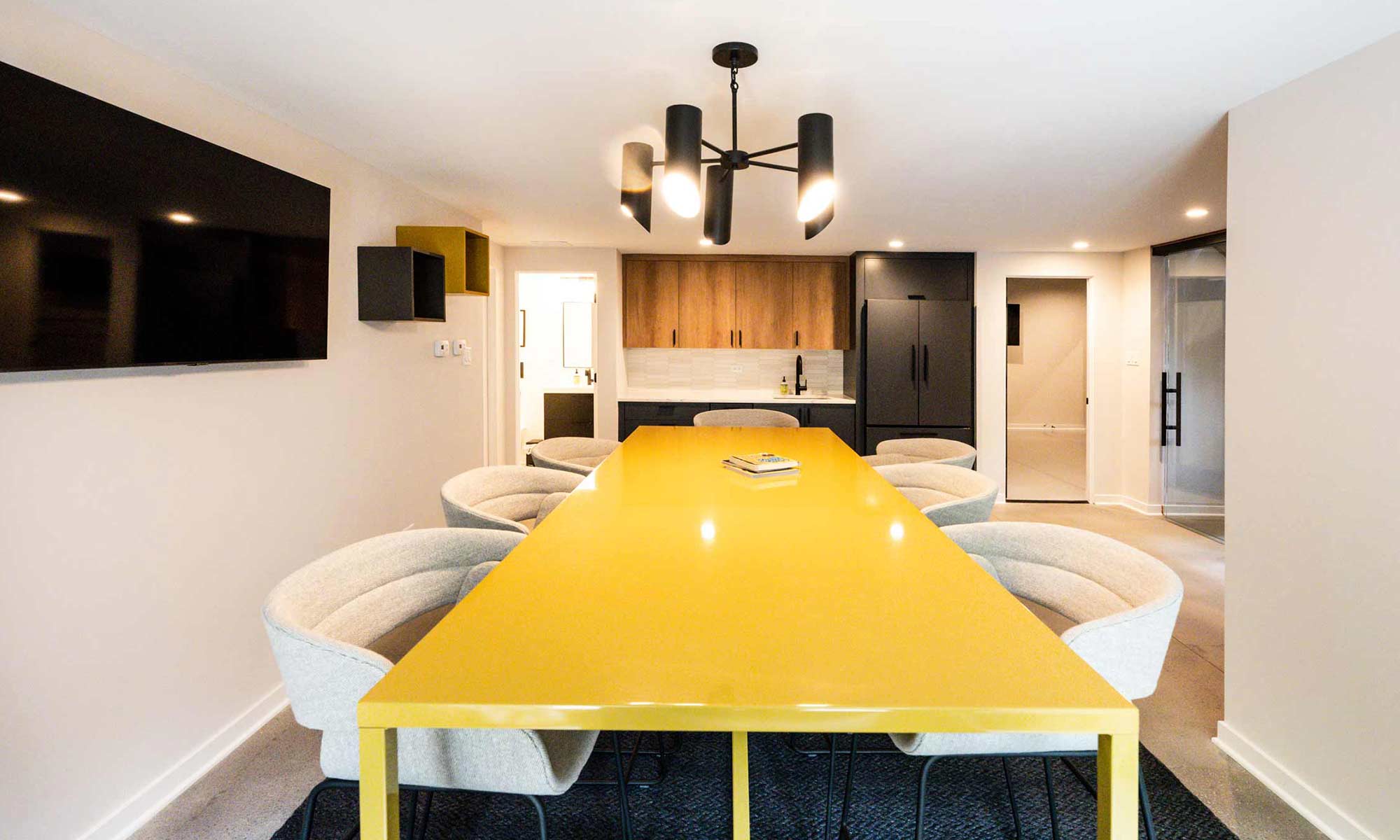 yellow table and tall chairs in luxury basement remodel