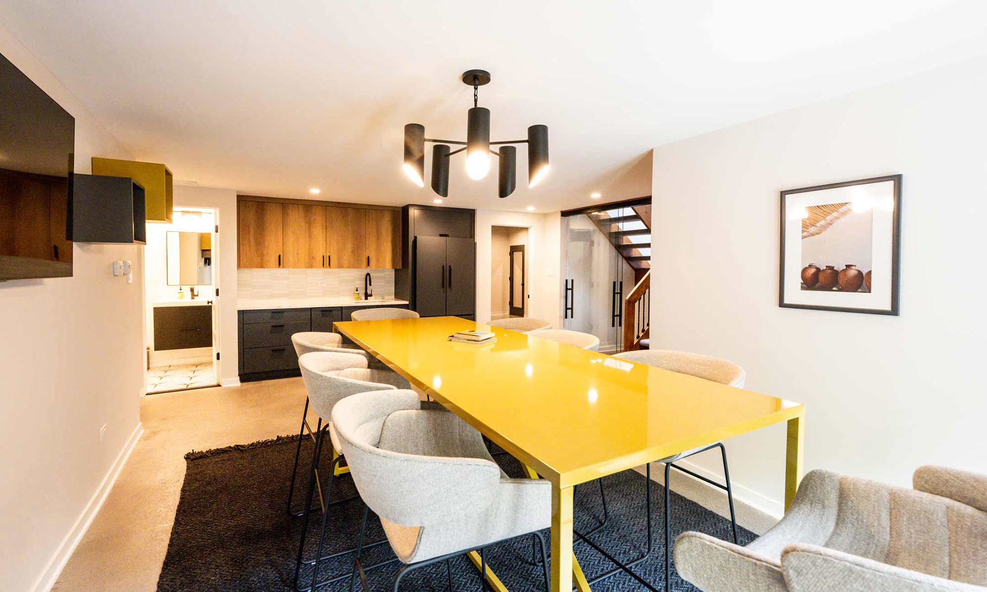 yellow table and tall chairs in luxury basement remodel