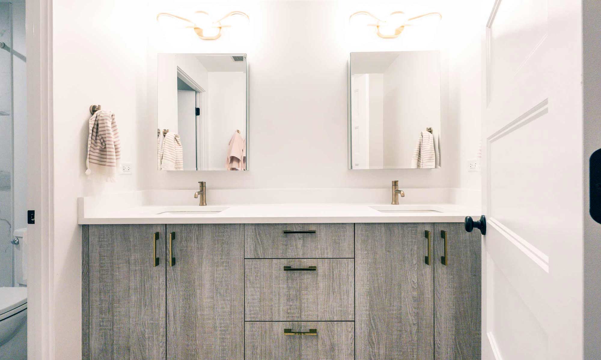 grey wood vanity in remodeled MCM bathroom