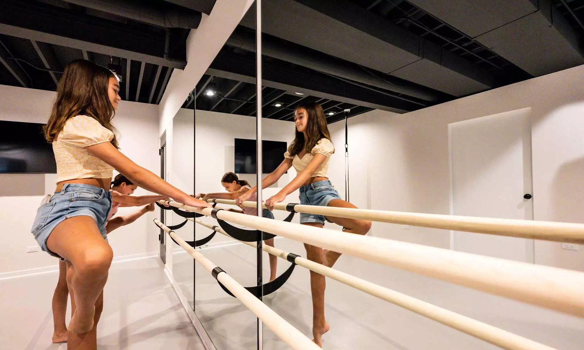 girls stretching in home dance studio
