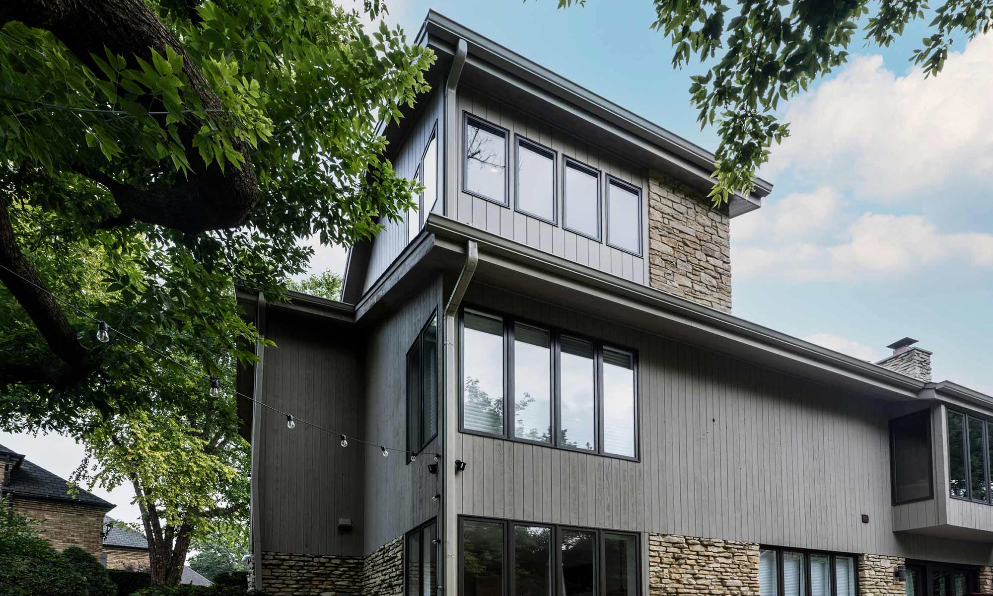 exterior view of mid century modern second floor home office addition