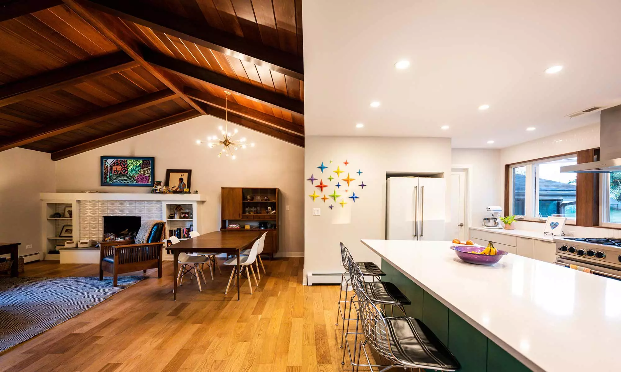 view of new MCM kitchen addition with green island and vaulted wood ceilings