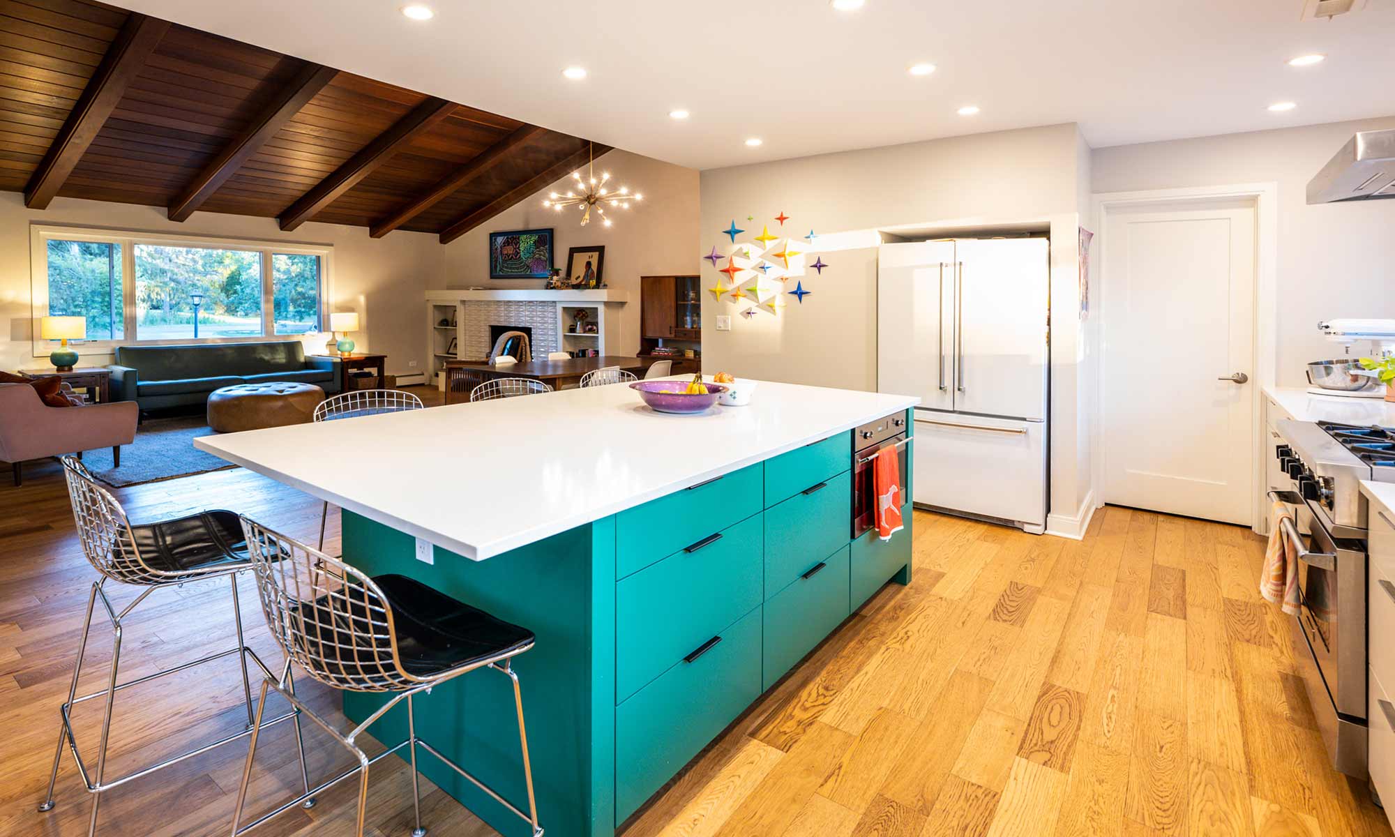 view of green kitchen island storage in MCM luxury addition