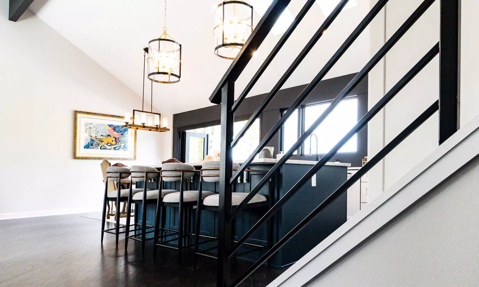 luxury kitchen remodel with blue island and windows to the backyard pool