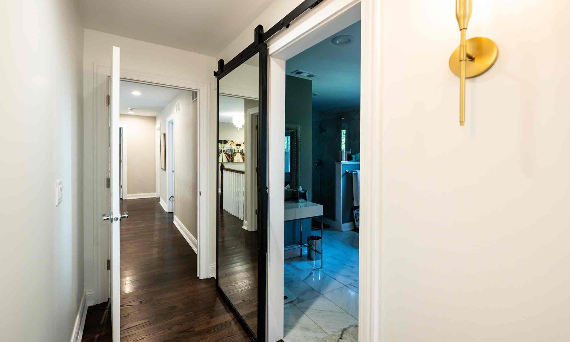 looking down the hall with a barn door