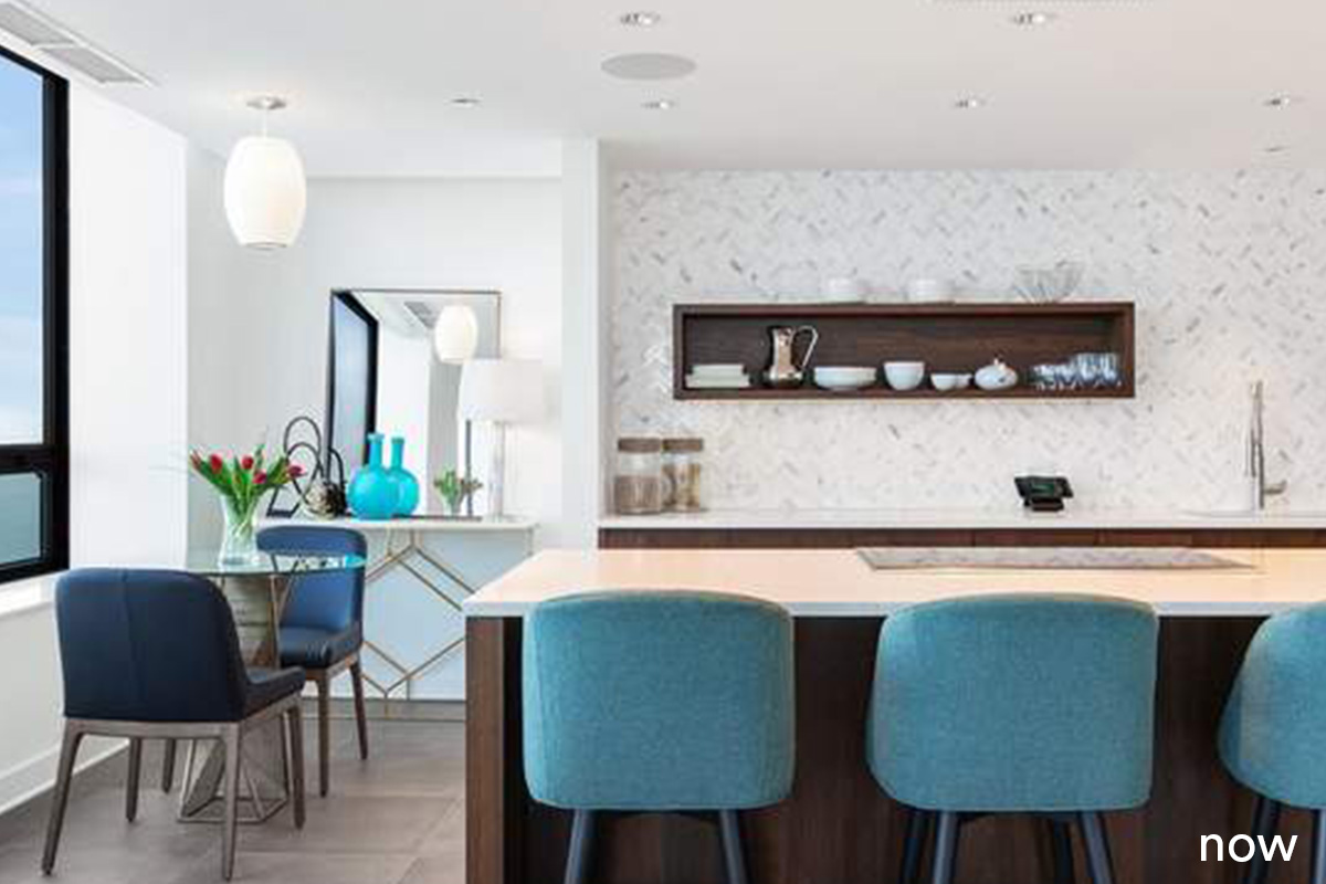 liv companies kitchen renovation with blue accents over white and brown island and backsplash