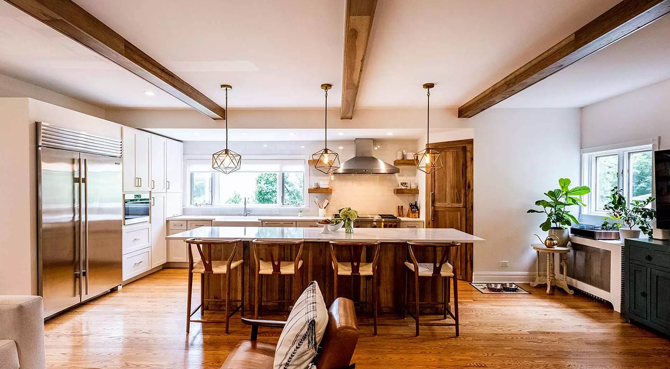 bright kitchen remodel exposed ceiling beams white cabniets stainless steel appliances large island