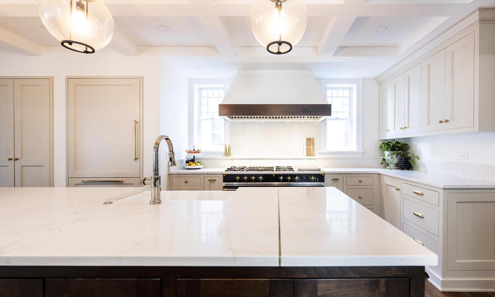 luxury kitchen remodel with blue pantry cabinets and beverage bar