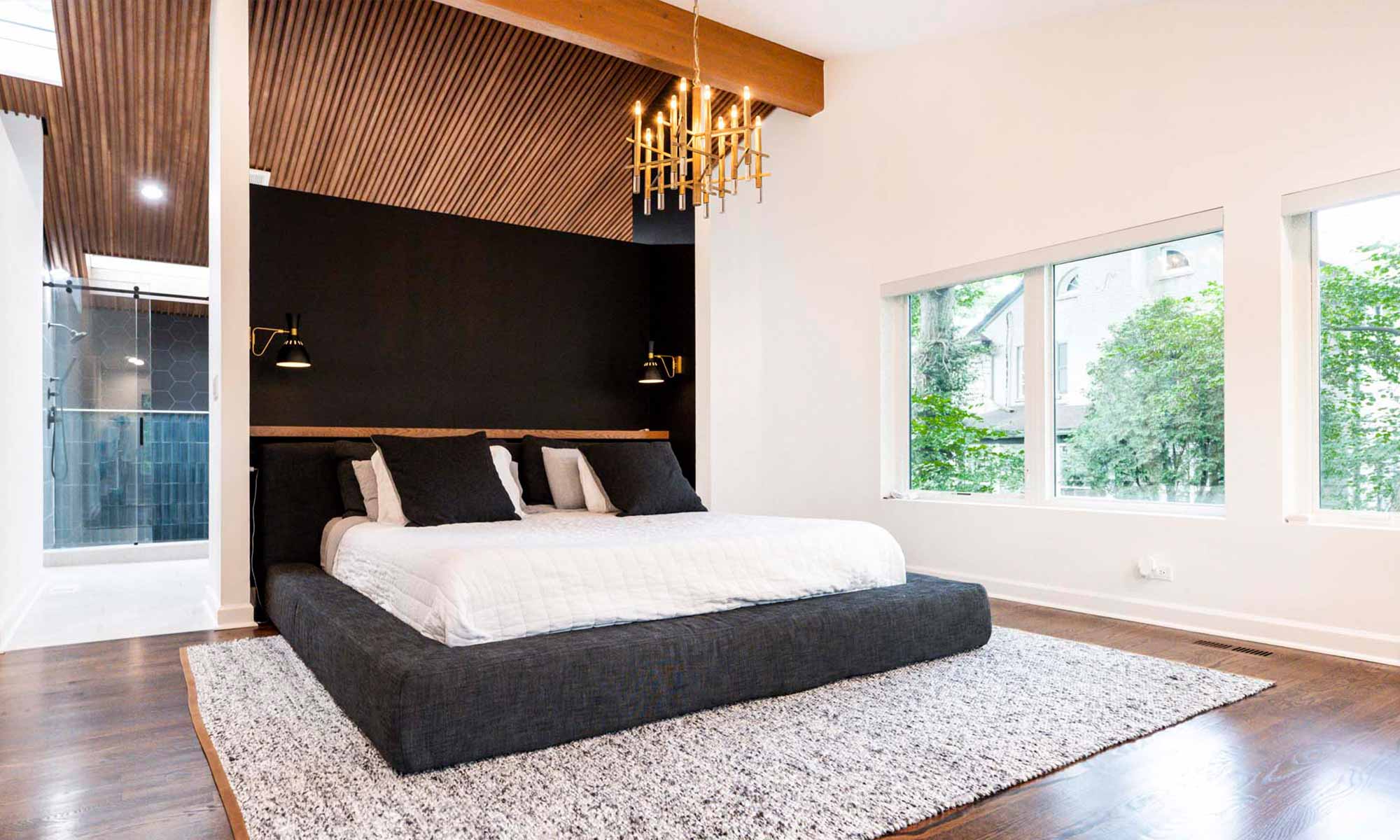 Wood ceiling behind primary suite bed wall in luxury modern remodel in hinsdale by livco