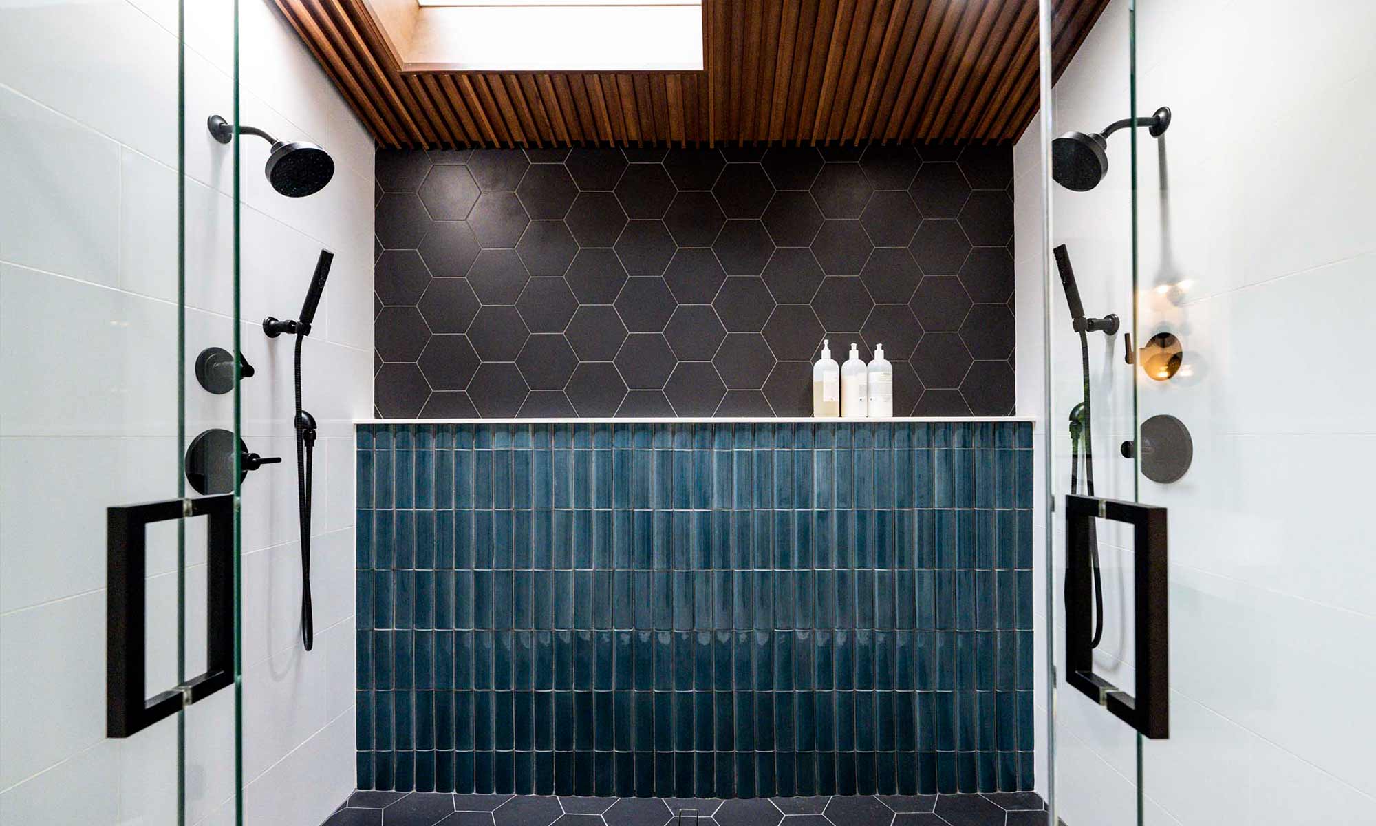 view of blue and grey modern walk in shower design by LivCo