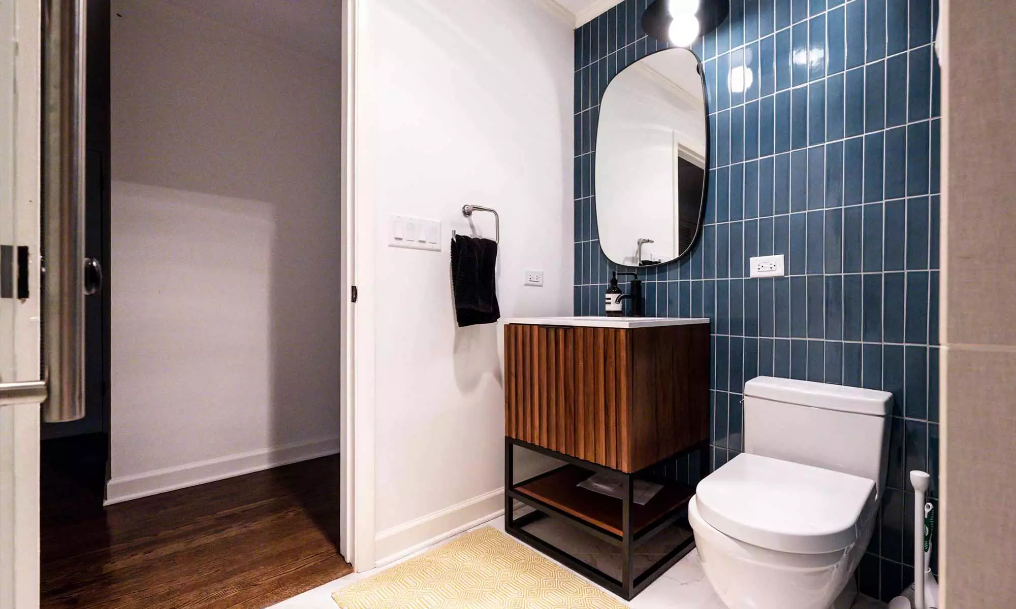 modern bathroom remodel with wood vanity and blue wall tile in hinsdale, illinois