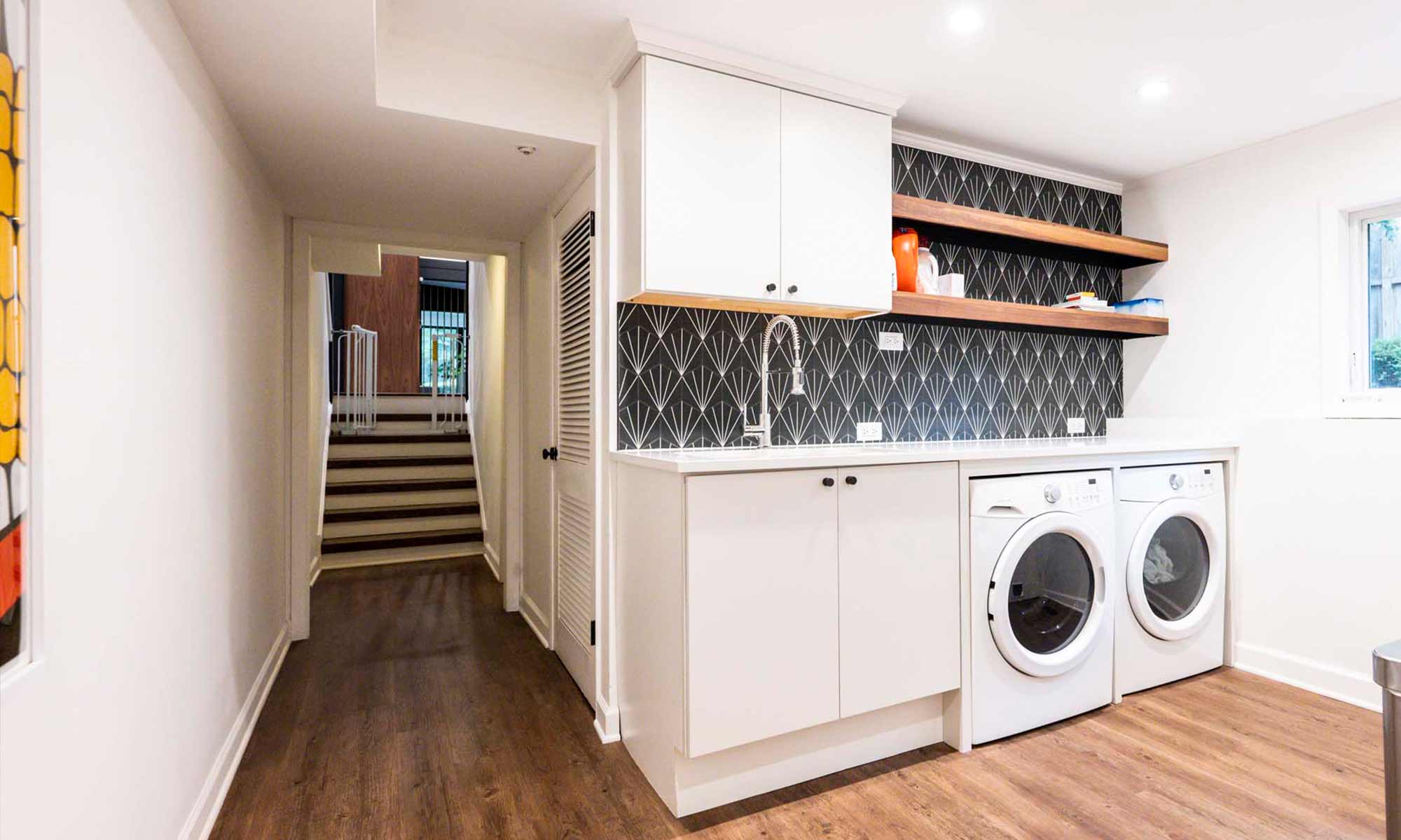 modern laundry room remodel with patterned backsplash tile