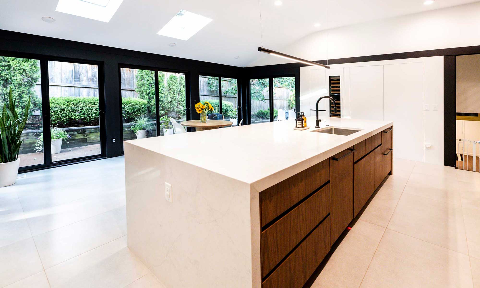 modern kitchen remodel looking out to backyard through sliding doors in hinsdale, illinois
