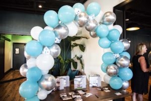 Teal, white, & silver balloon arch at LivCo’s Ten Year Anniversary Party at The Elm