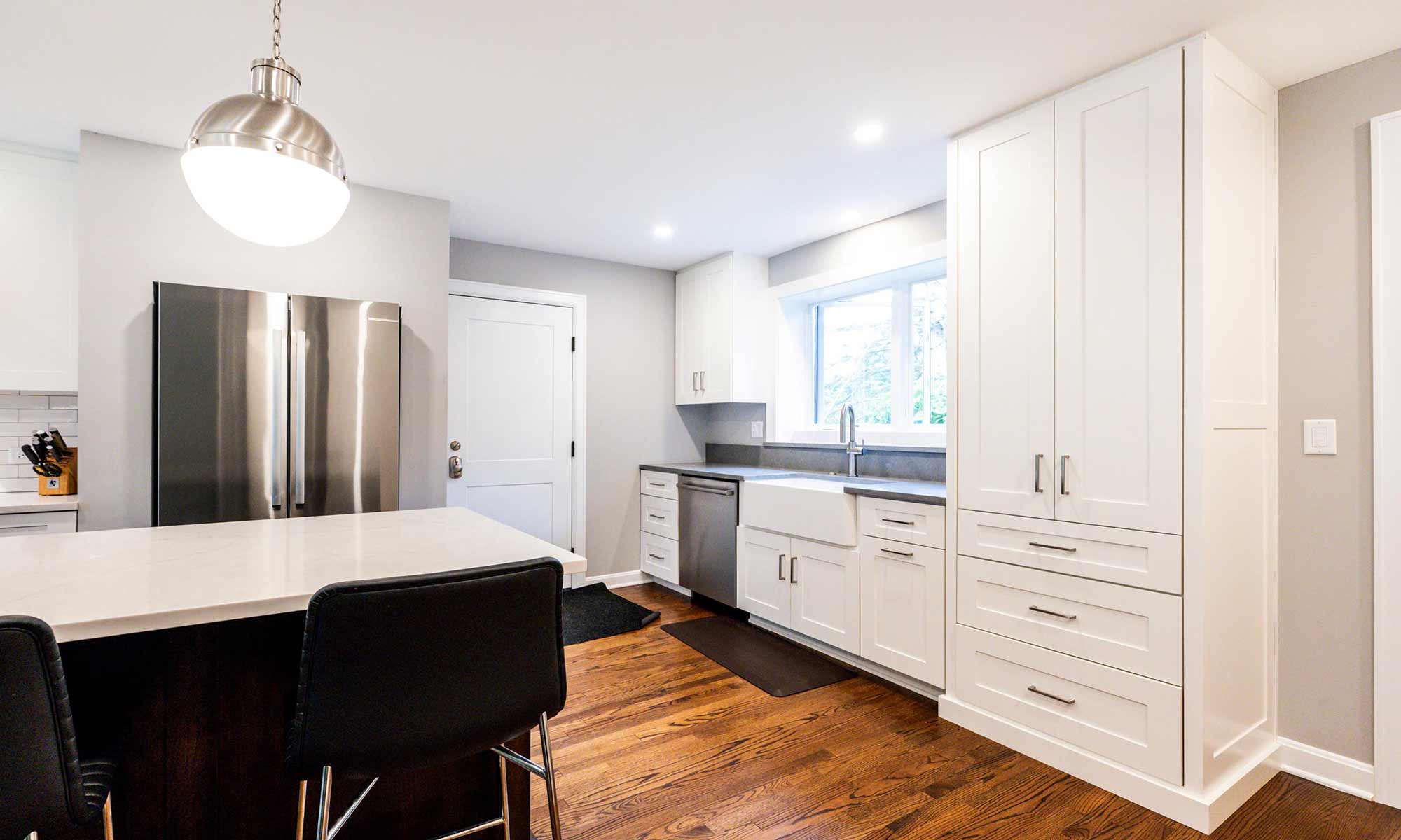 tall white cabinets at appliance garage of luxury riverside illinois remodel