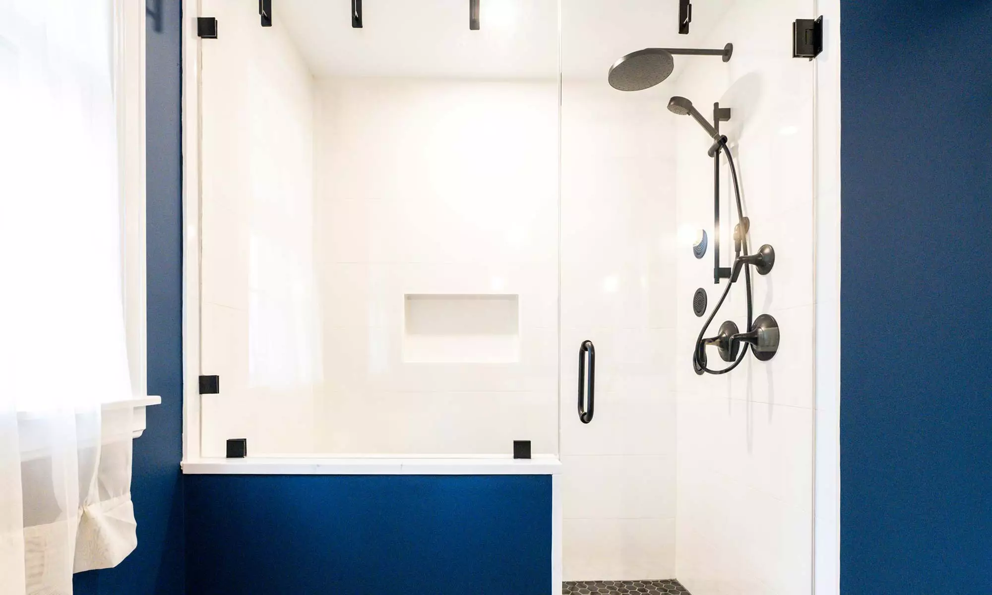 luxury bathroom remodel with white shower and blue walls