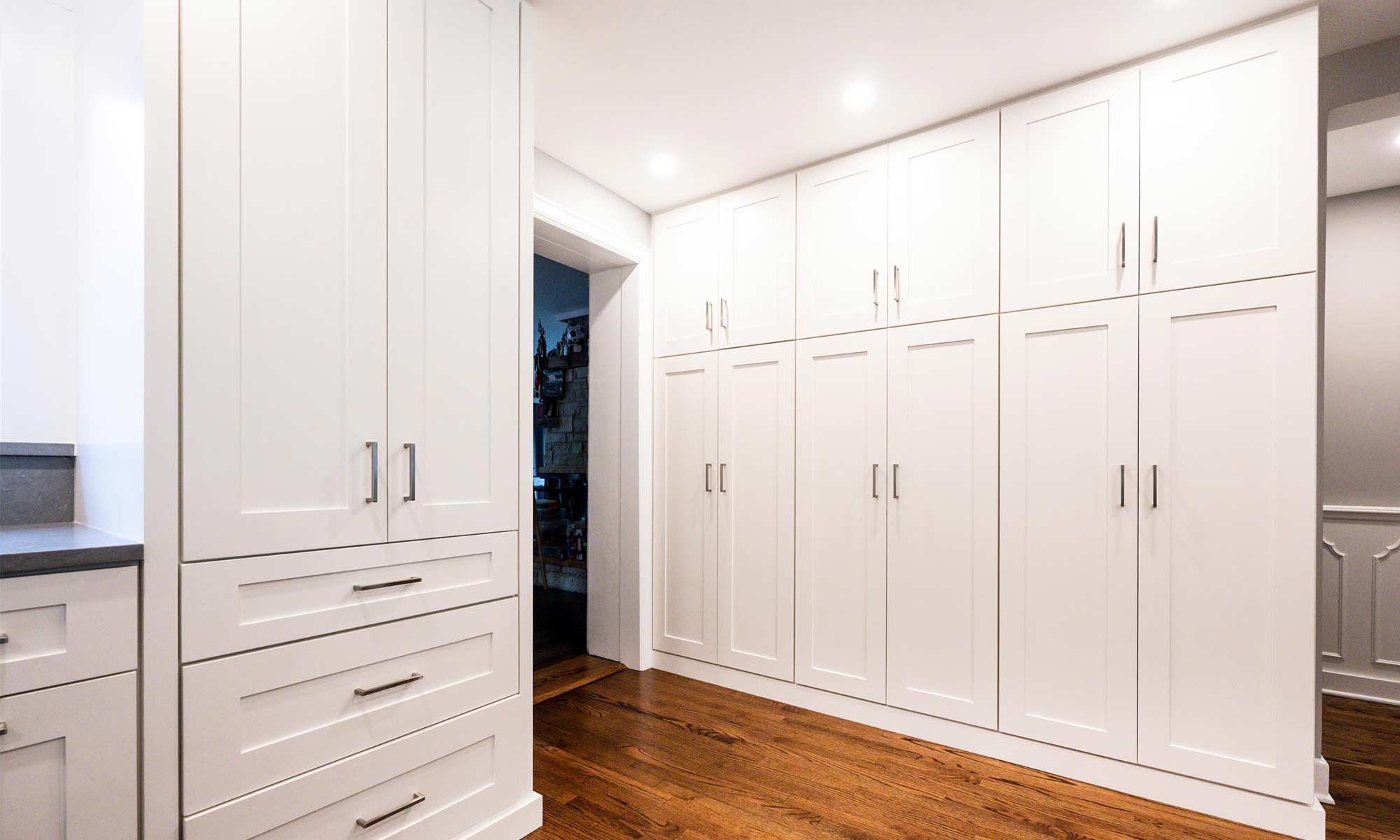 tall white cabinets at appliance garage of luxury riverside illinois remodel