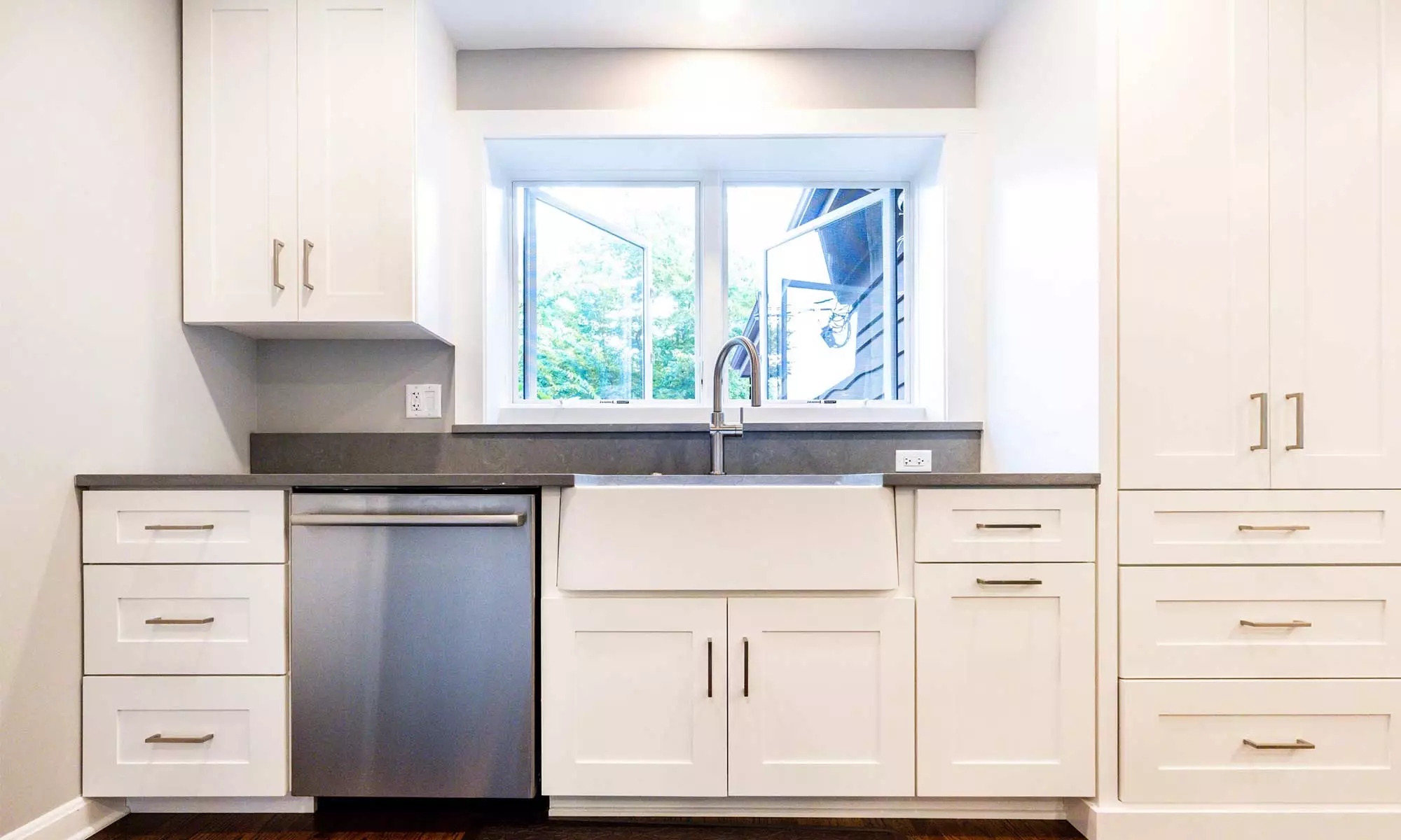 apron kitchen sink and tall white cabinets at appliance garage of luxury riverside illinois remodel