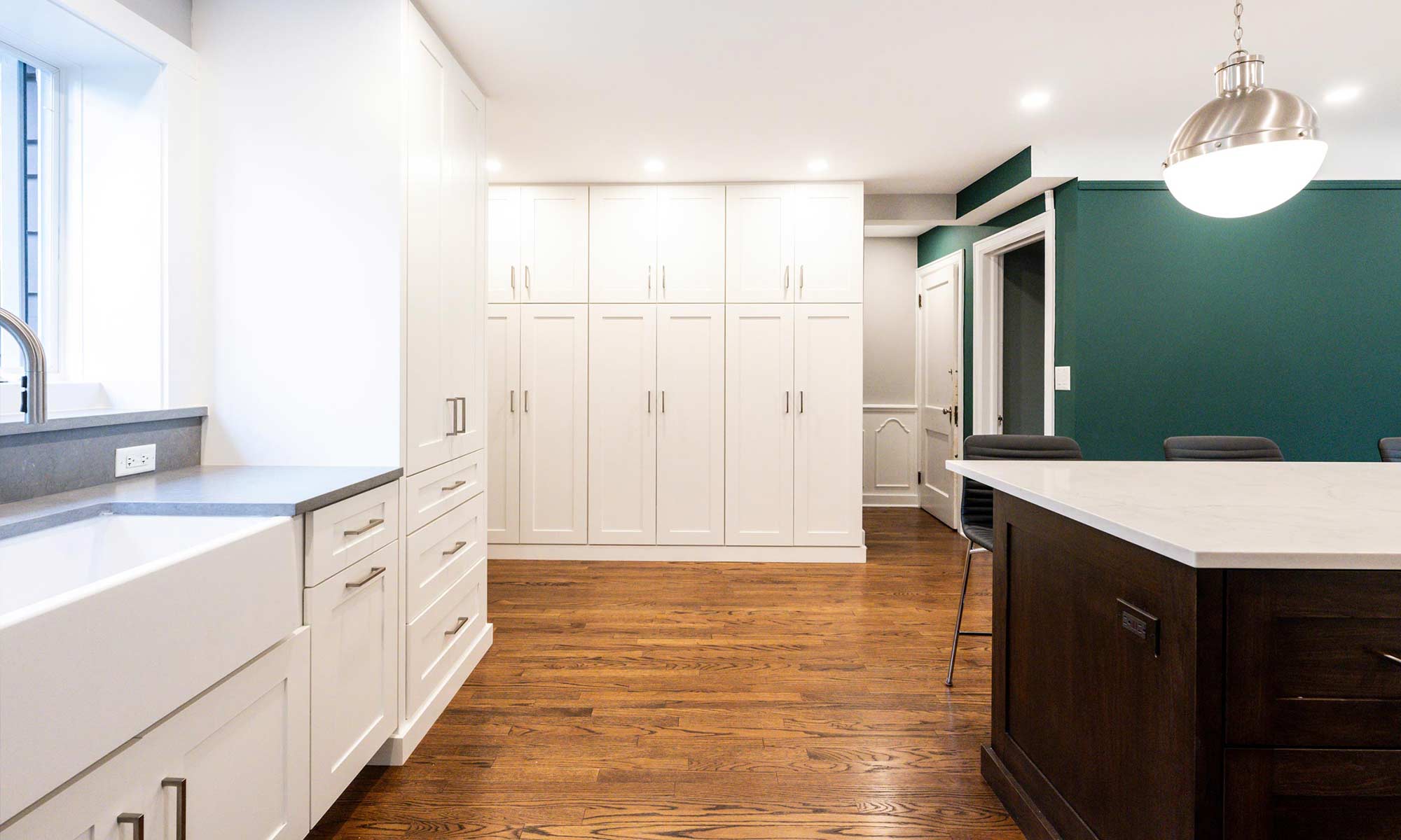 tall white cabinets at appliance garage of luxury riverside illinois remodel