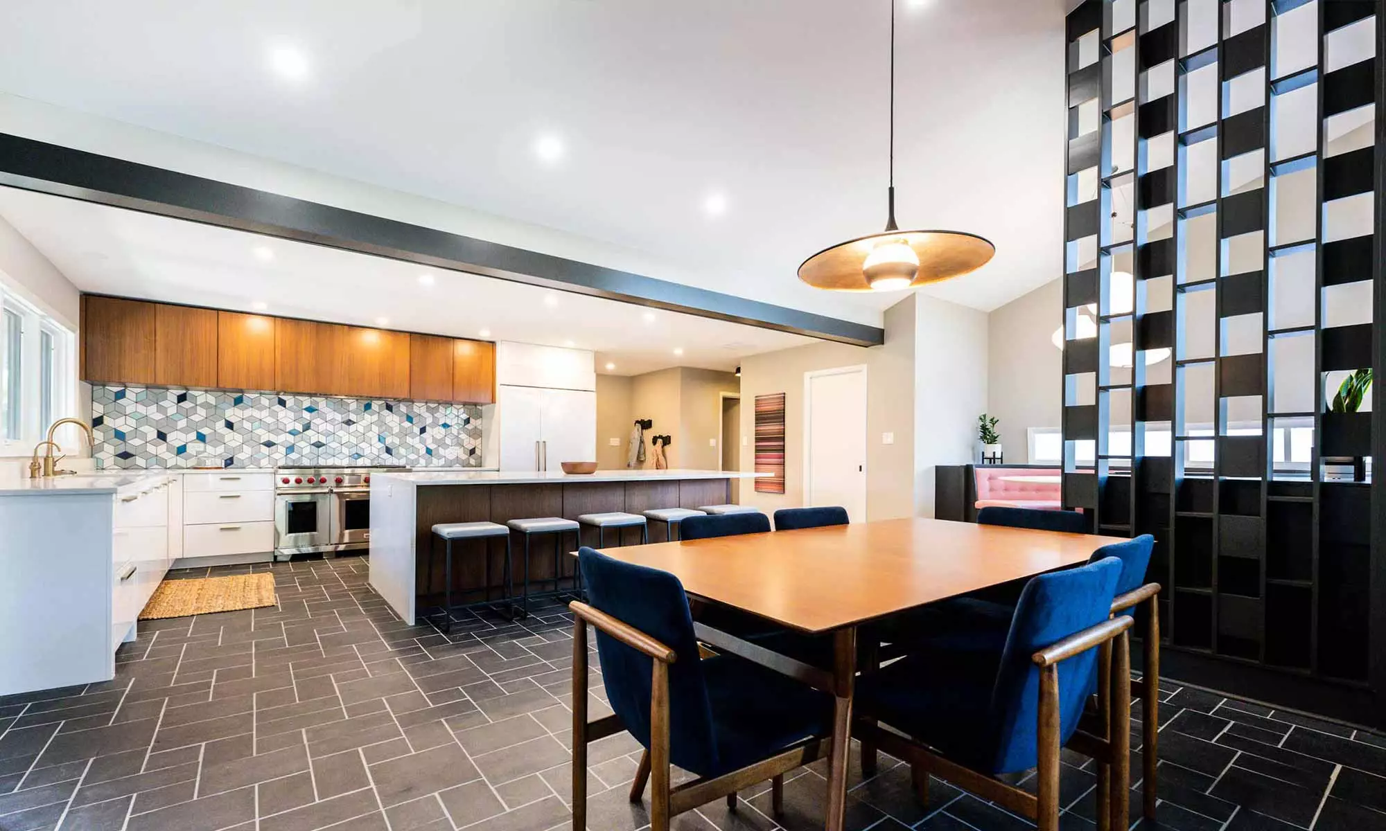 view of mid century kitchen remodel with dining and booth seating from family room