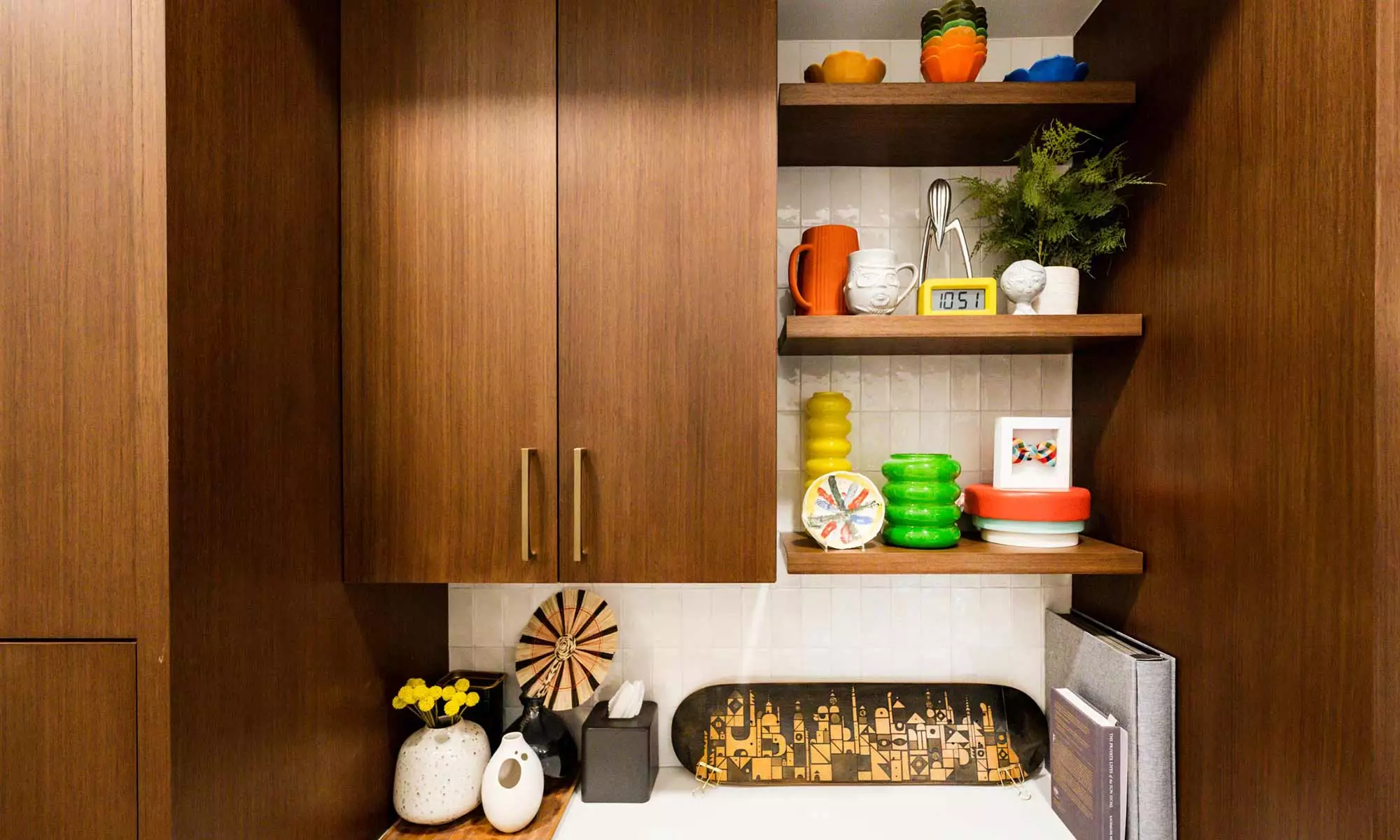 builtin walnut bar cabinets with open shelves in mid century modern mudroom remodel in Riverside IL designed and built by LivCo