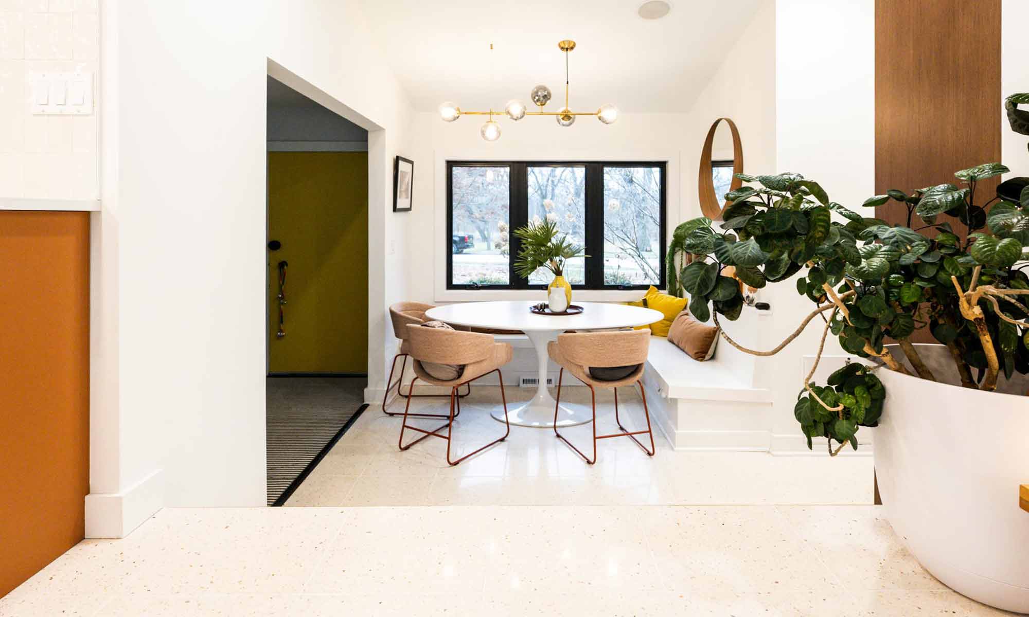 sunken breakfast room under windows in luxury mid century modern remodel by LivCo in Riverside IL