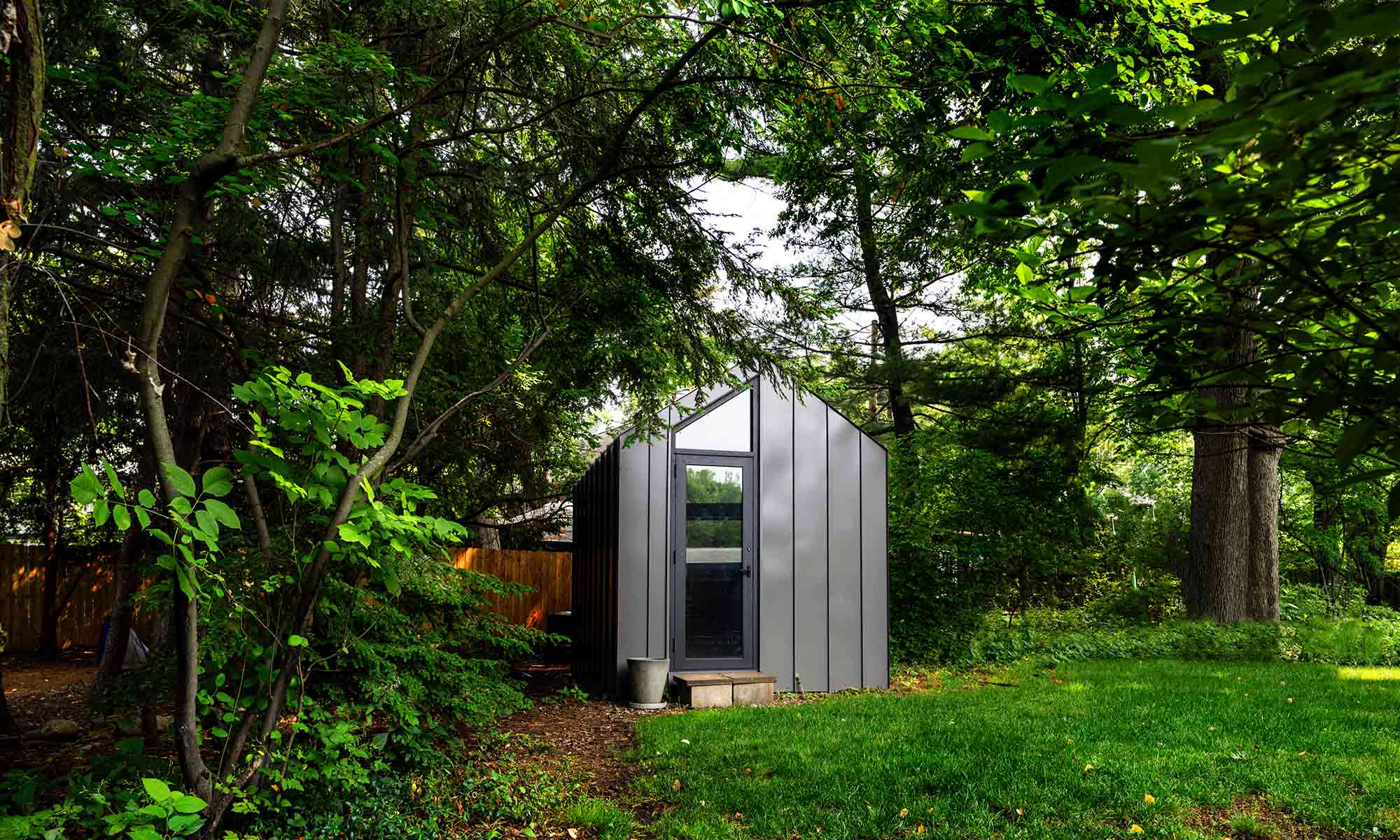 Grey Metal siding outdoor home office bunkie shed from exterior