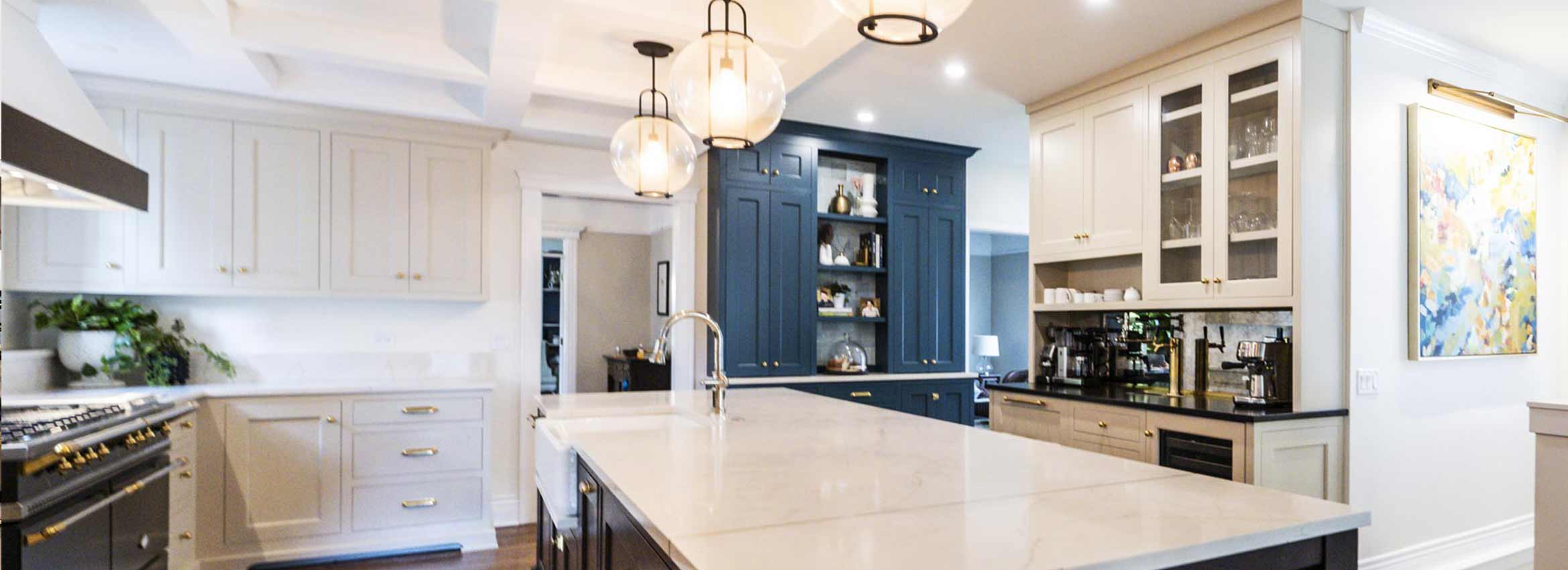 luxury kitchen remodel in la grange illinois with blue pantry cabinets stone countertops and gourmet range