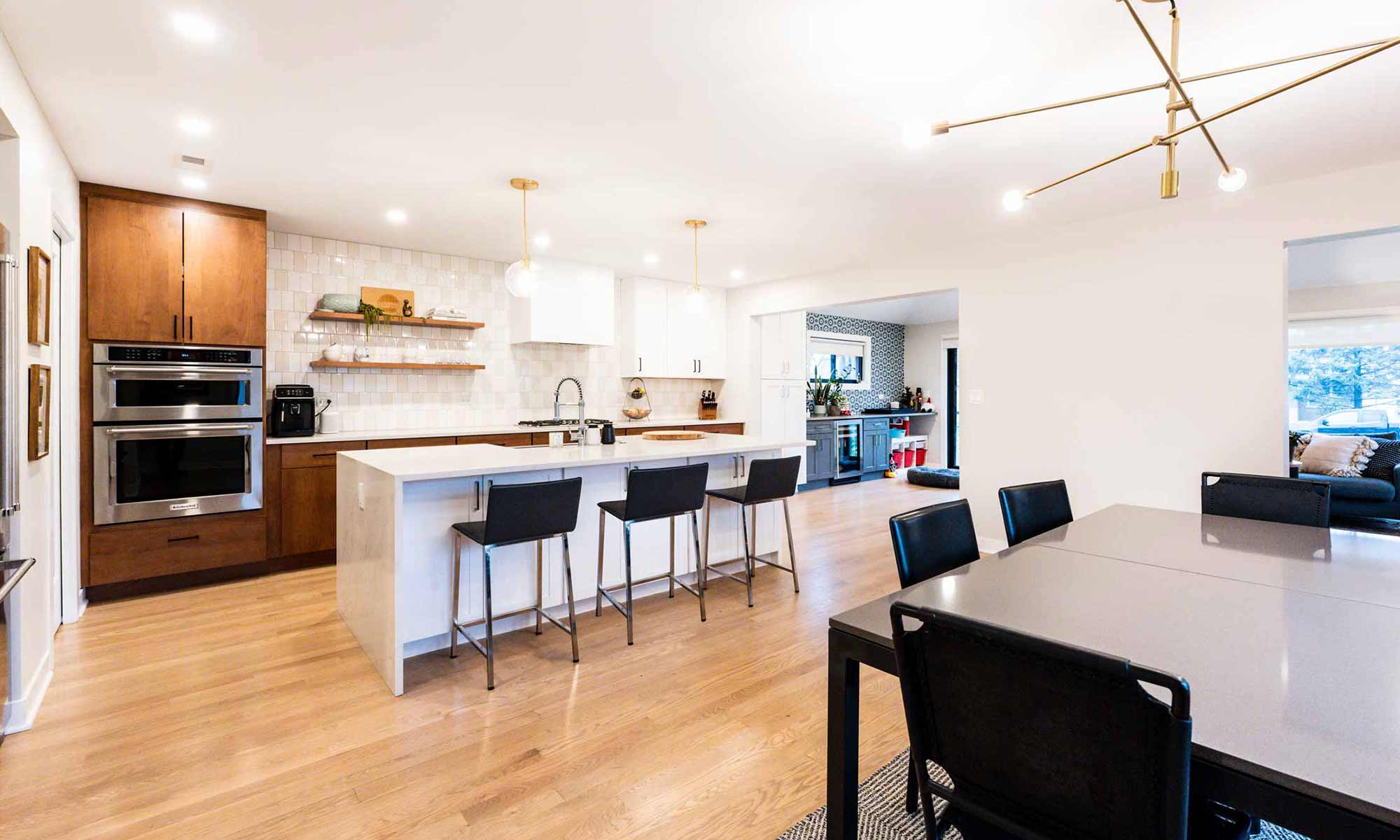 modern kitchen remodel with wood and white cabinets in western springs