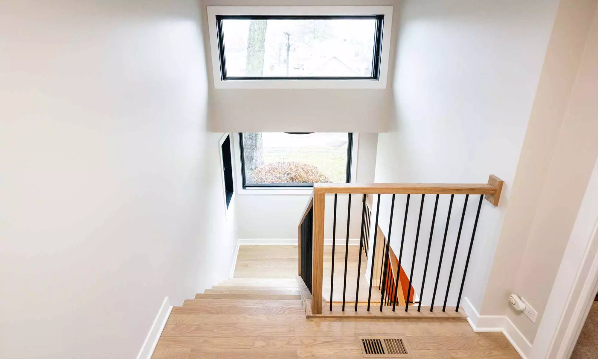 white oak stairway in luxury second floor addition