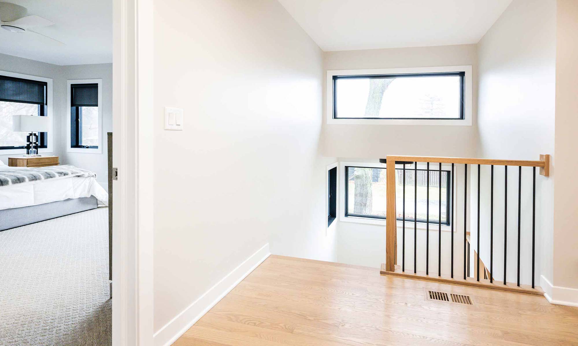 view of stairway and primary bedroom from hallway in luxury 2nd story addition