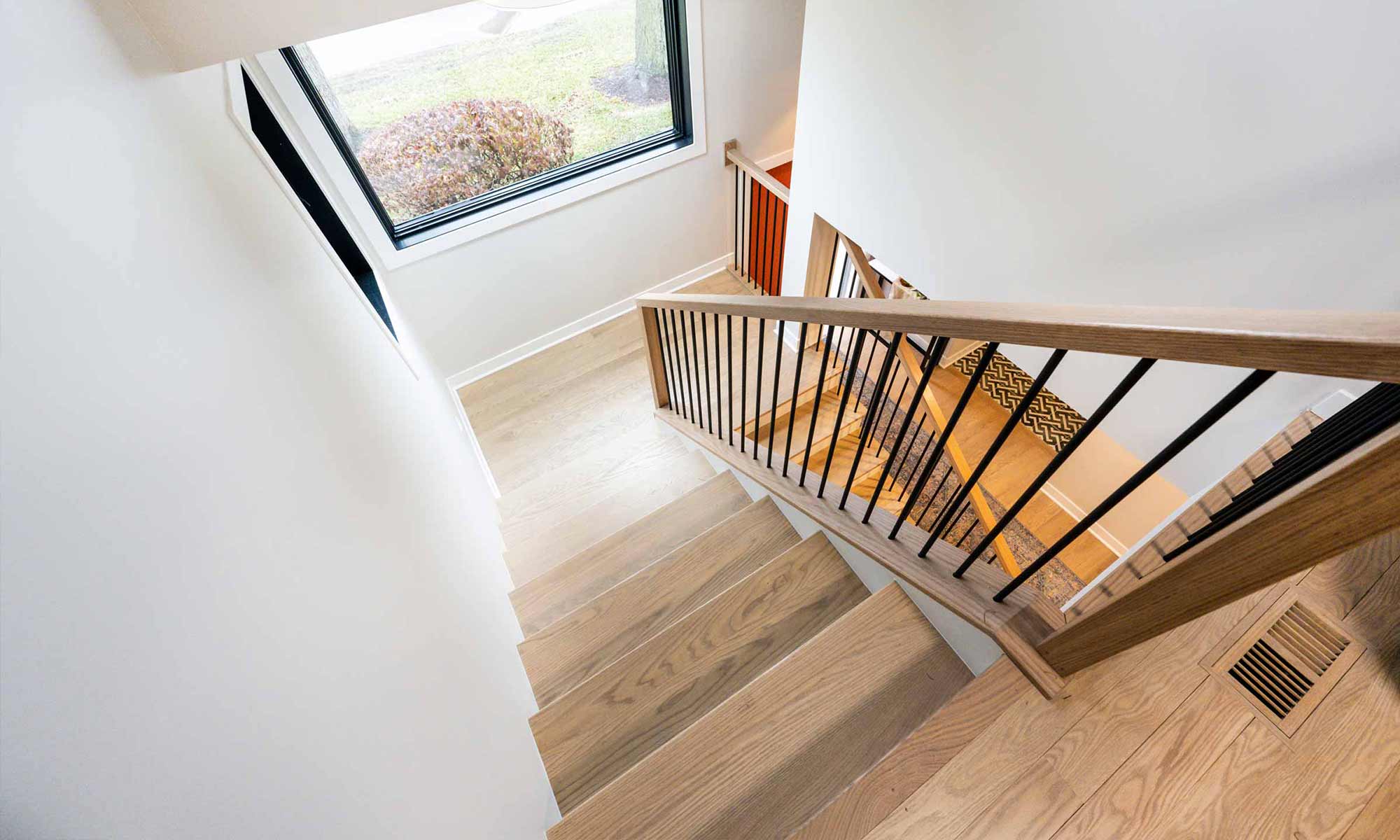 white oak stairway in luxury second floor addition