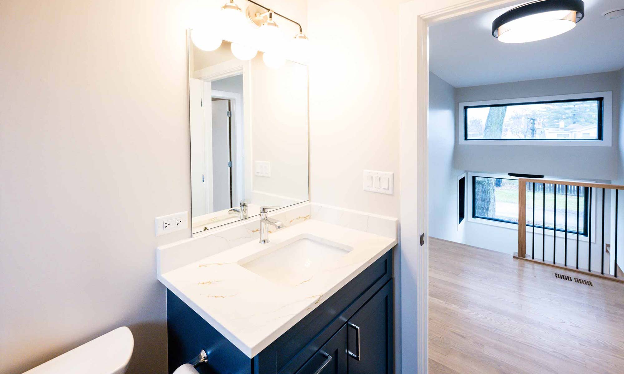 luxury bathroom remodel with blue vanity