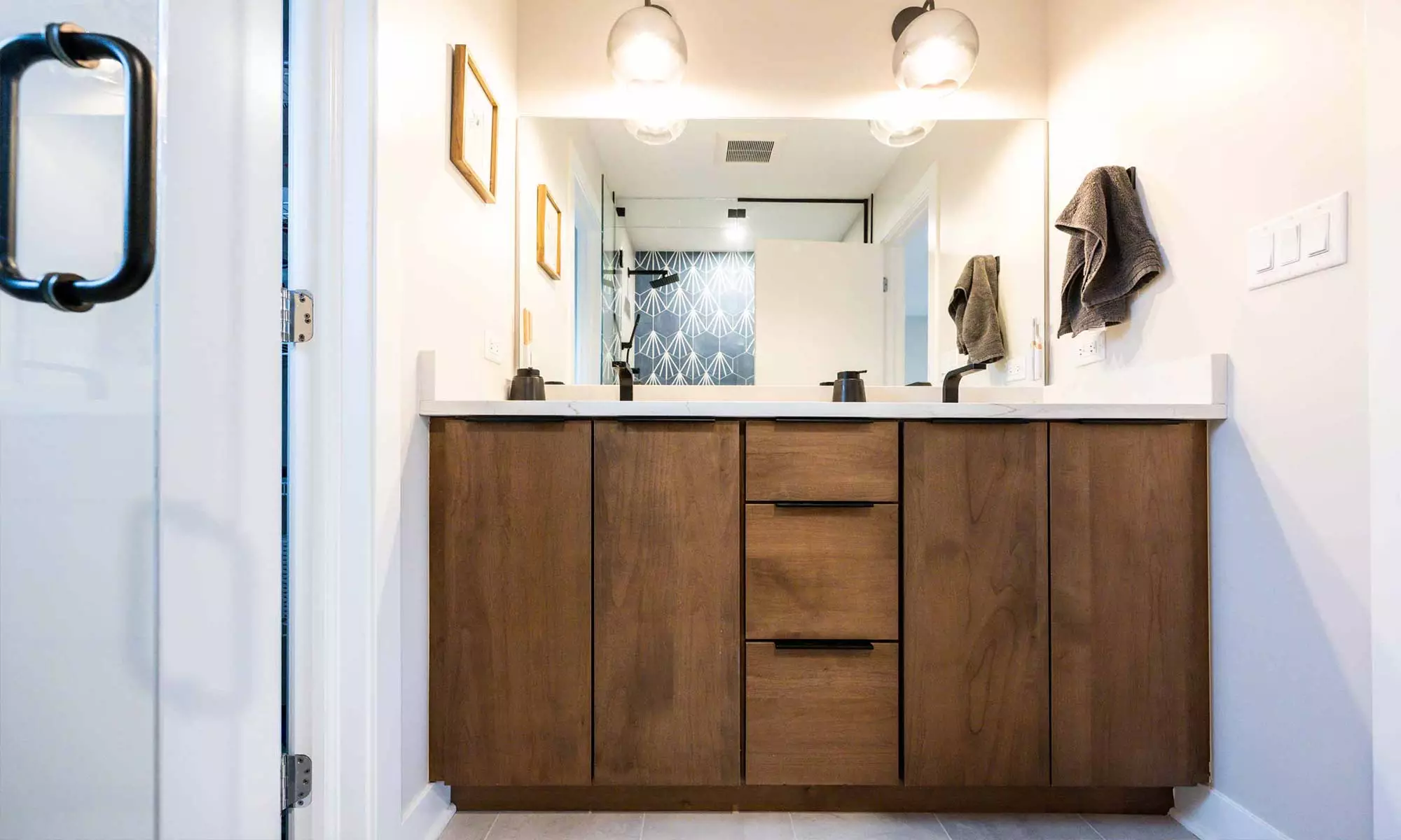 double vanity in wood with black fixtures in luxury western springs remodel and addition