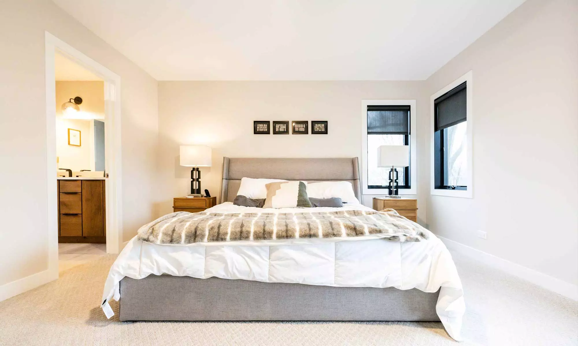 king size bed in primary bedroom suite in luxury western springs addition