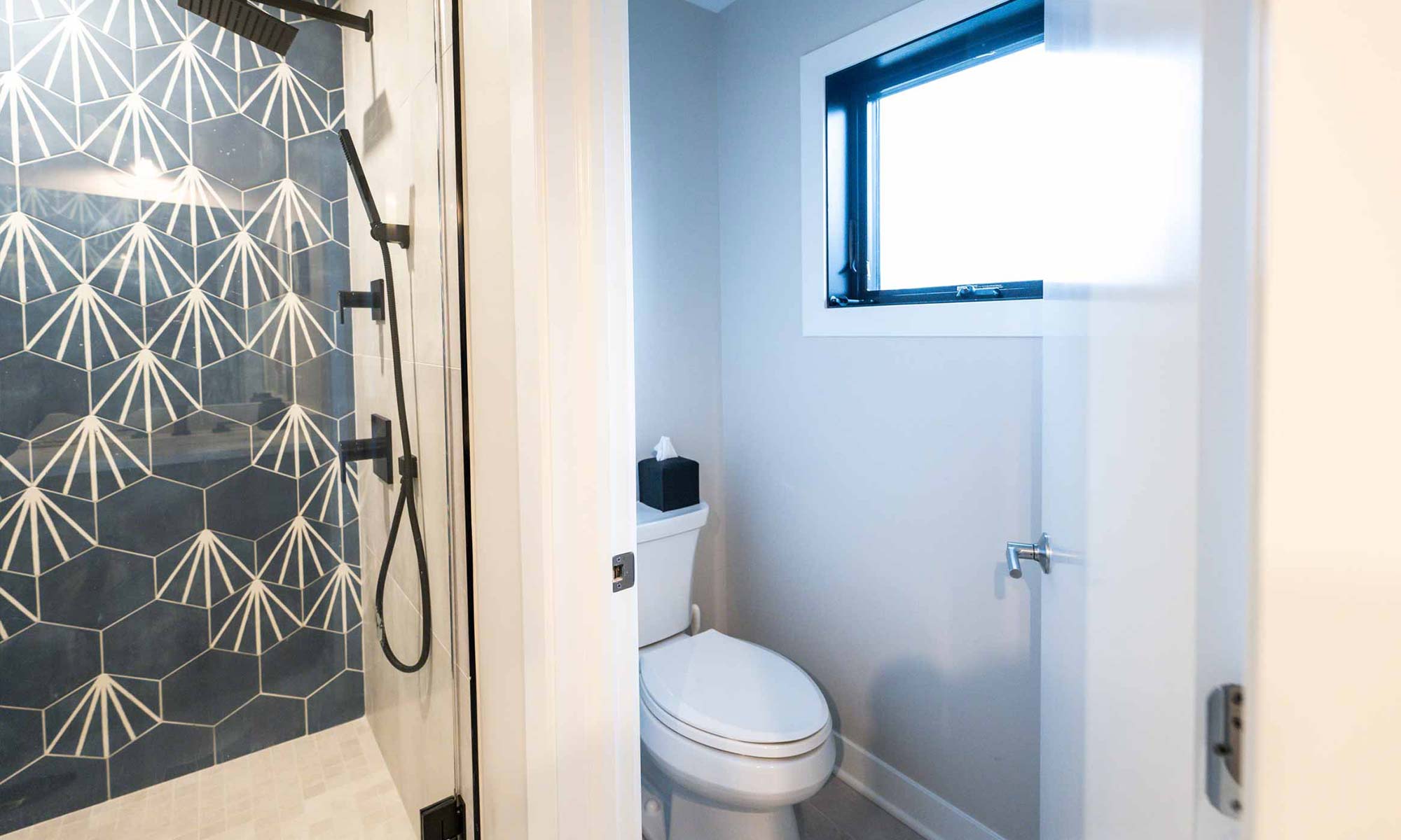 shower fixtures and body jets in black in luxury western springs remodel and addition and water closet