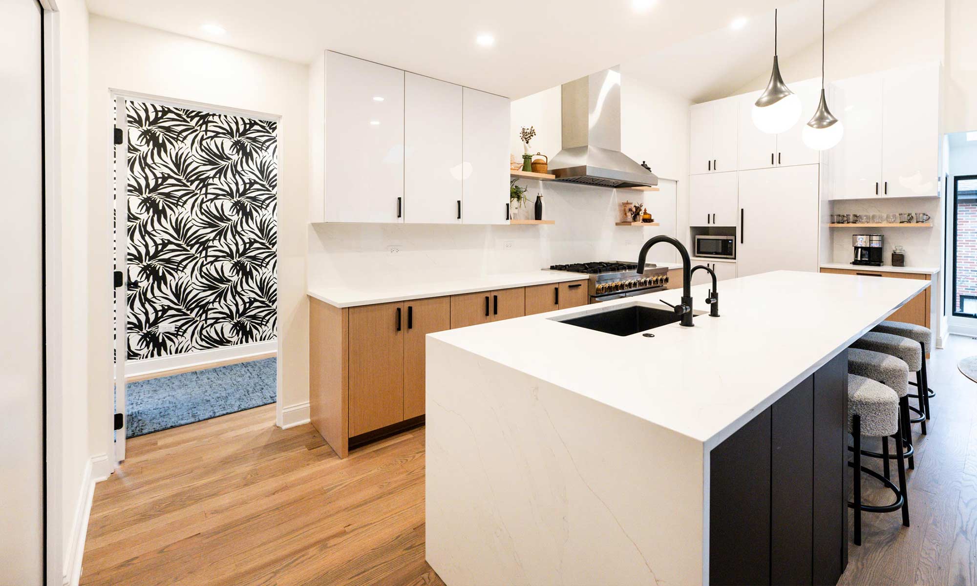 Indian Head Park luxury kithcen remodel by LivCo featuring wood, black, and gloss white modern cabinetry