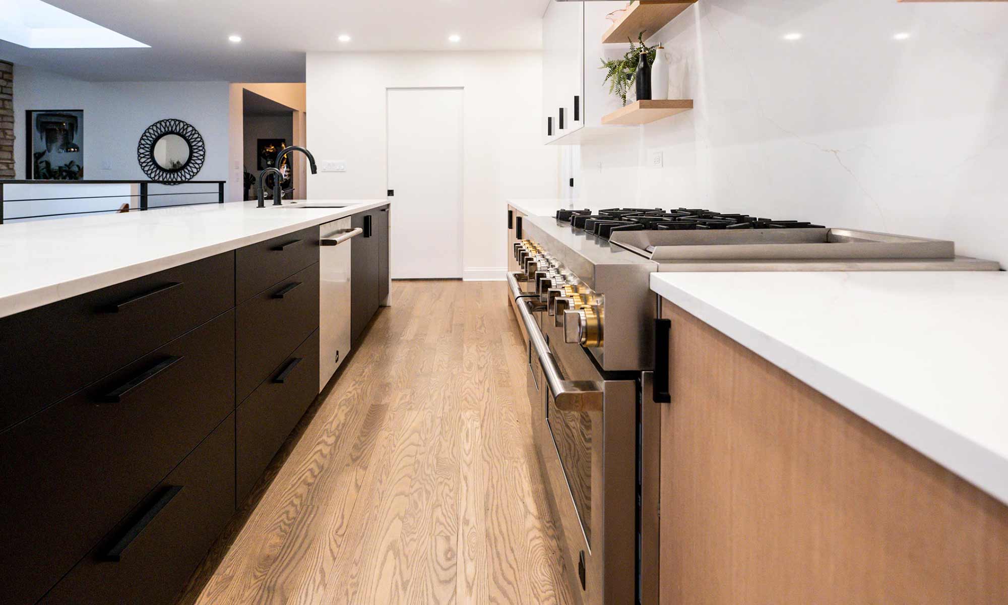 Indian Head Park luxury kithcen remodel by LivCo featuring wood, black, and gloss white modern cabinetry