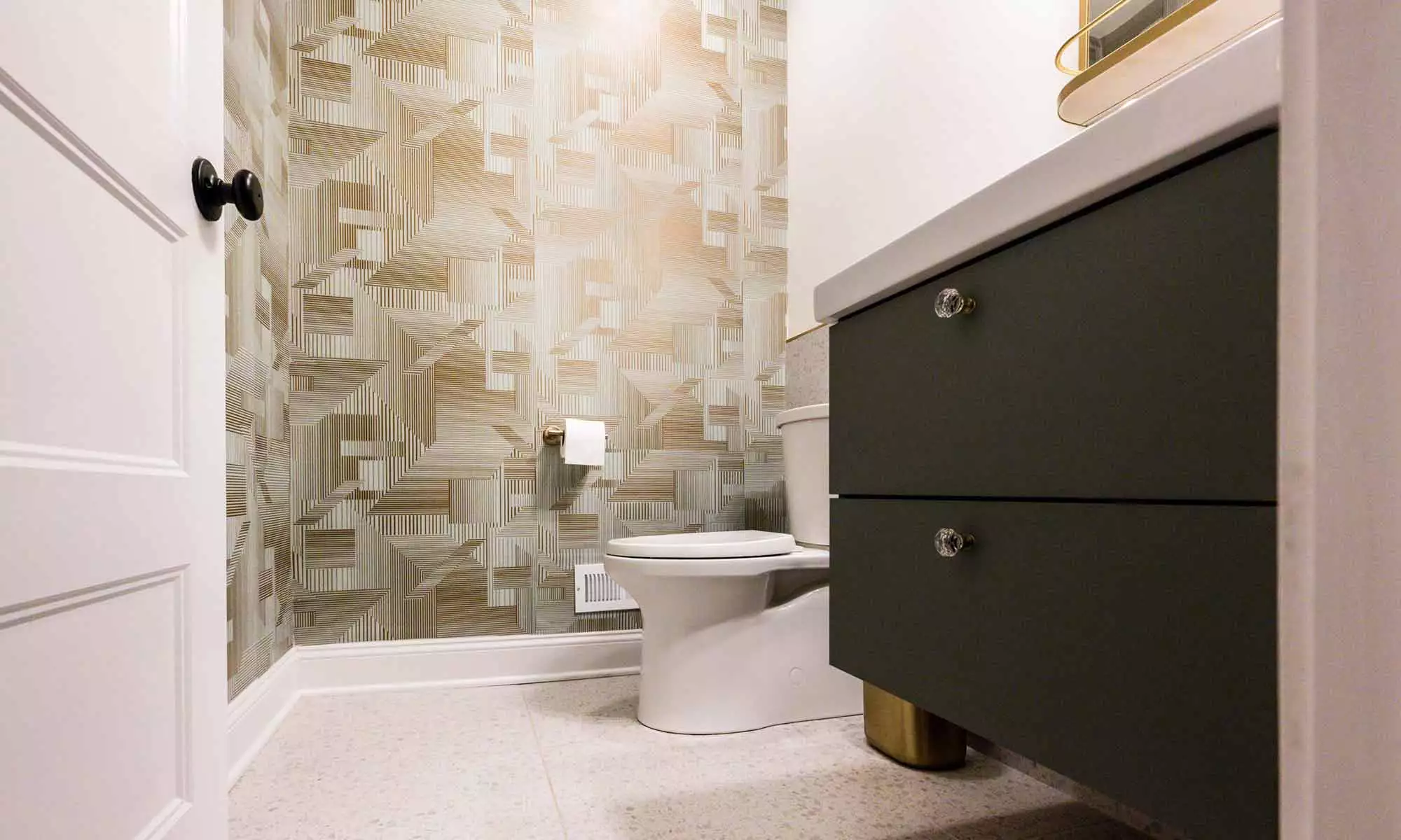 Luxury powder room remodel in Indian Head Park with textured geometric wallpaper and terrazzo flooring