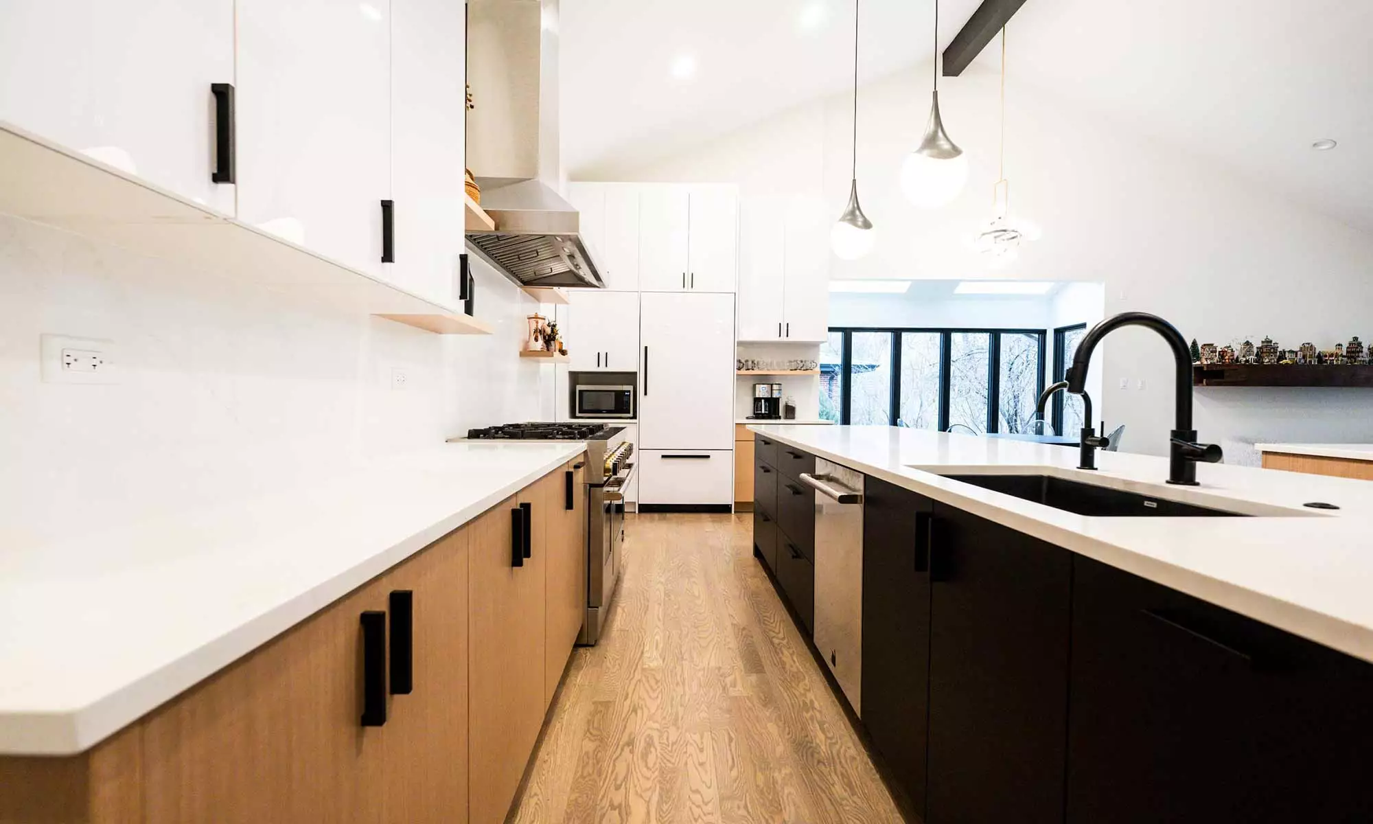 Indian Head Park luxury kithcen remodel by LivCo featuring wood, black, and gloss white modern cabinetry