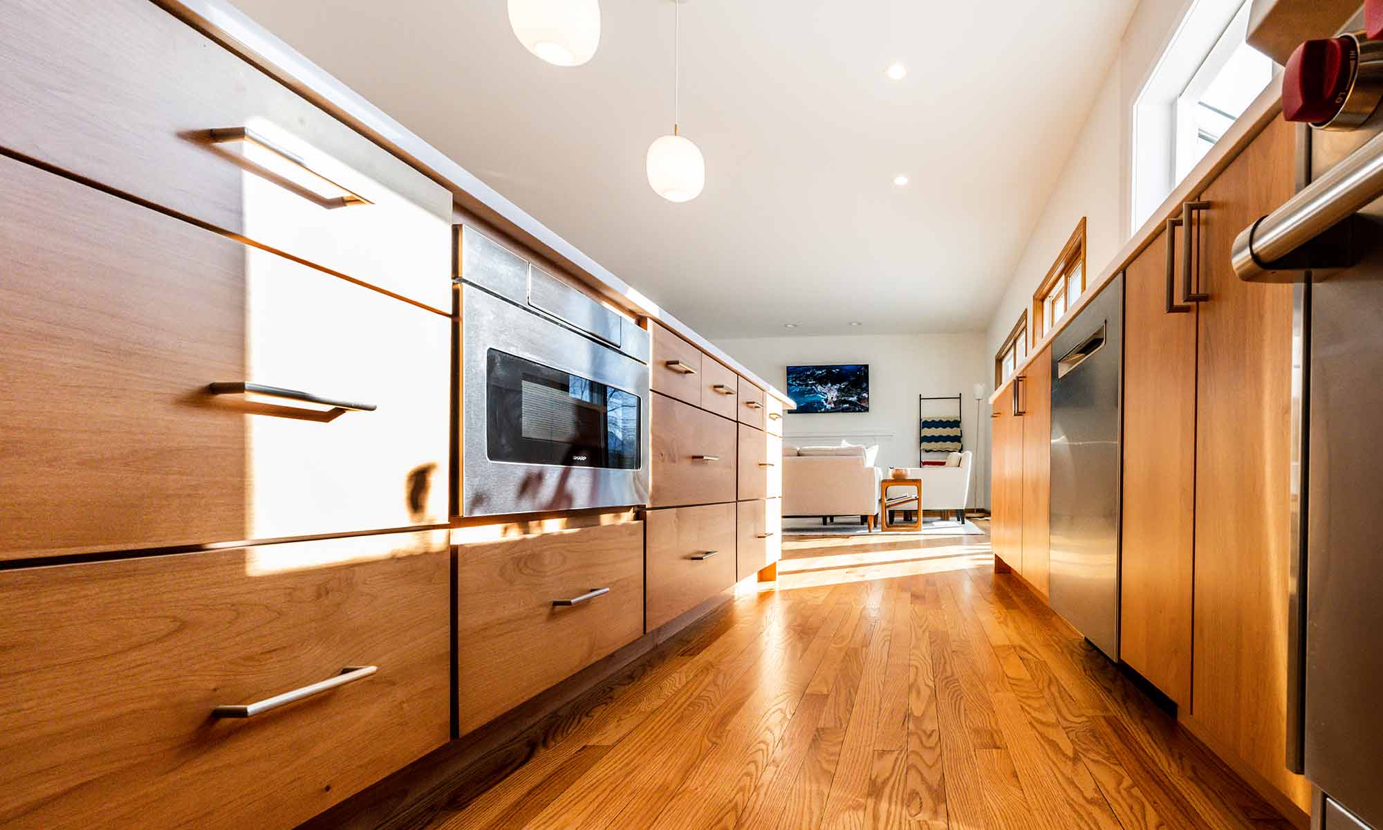 modern kitchen remodel with cherry cabinets and microwave drawer in island