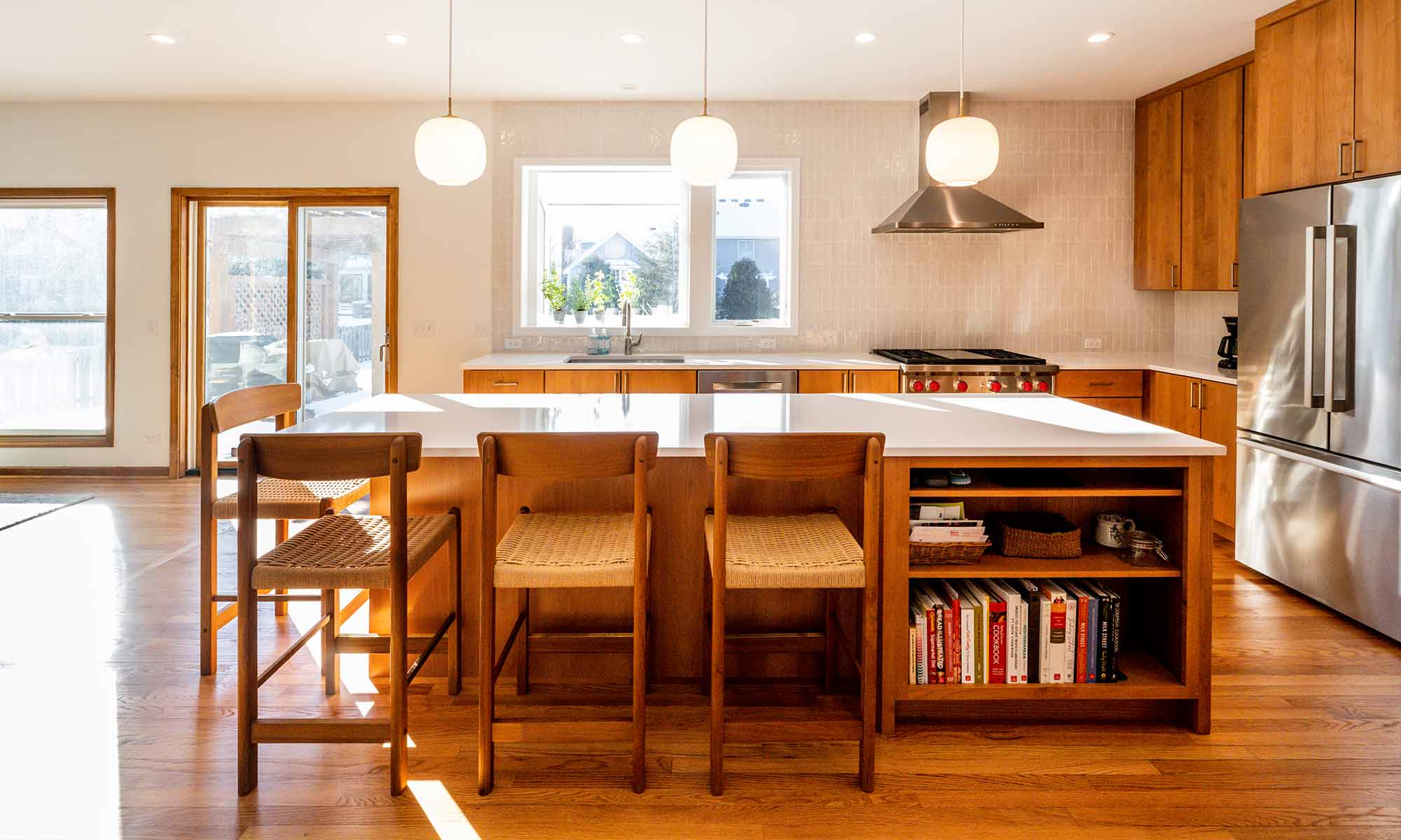 modern kitchen remodel with cherry cabinets open plan and white quartz island countertop