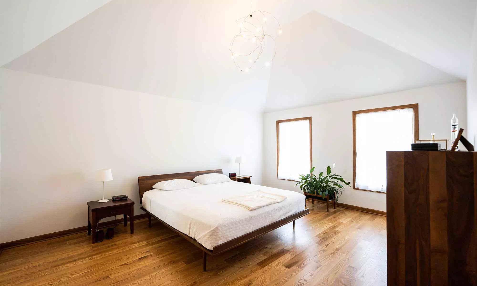 Scandinavian style wood bed in bedroom remodel in wheaton, illinois