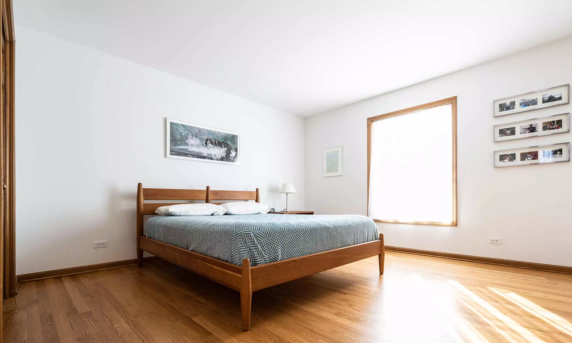 Scandinavian style wood bed in bedroom remodel in wheaton, illinois