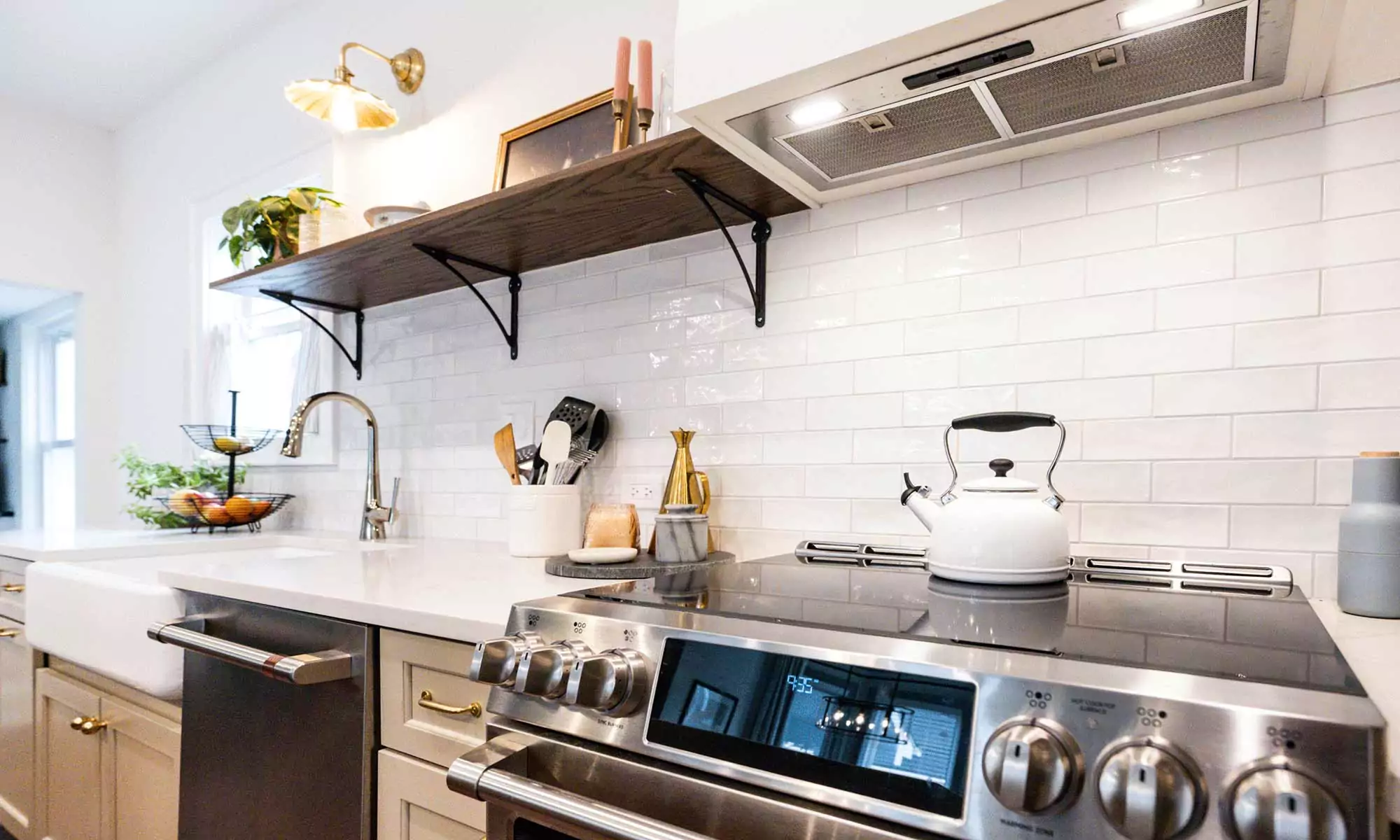 view of kitchen range farmhouse sink and open wood shelves in vintage la grange park kitchen remodel