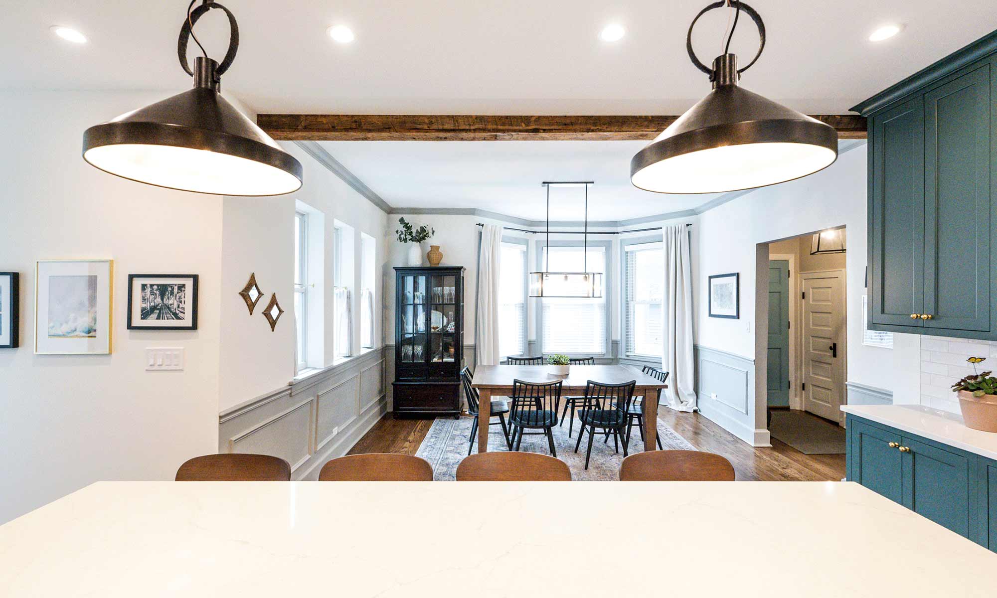 view from kitchen island towards dining room in vintage open plan remodel in la grange park