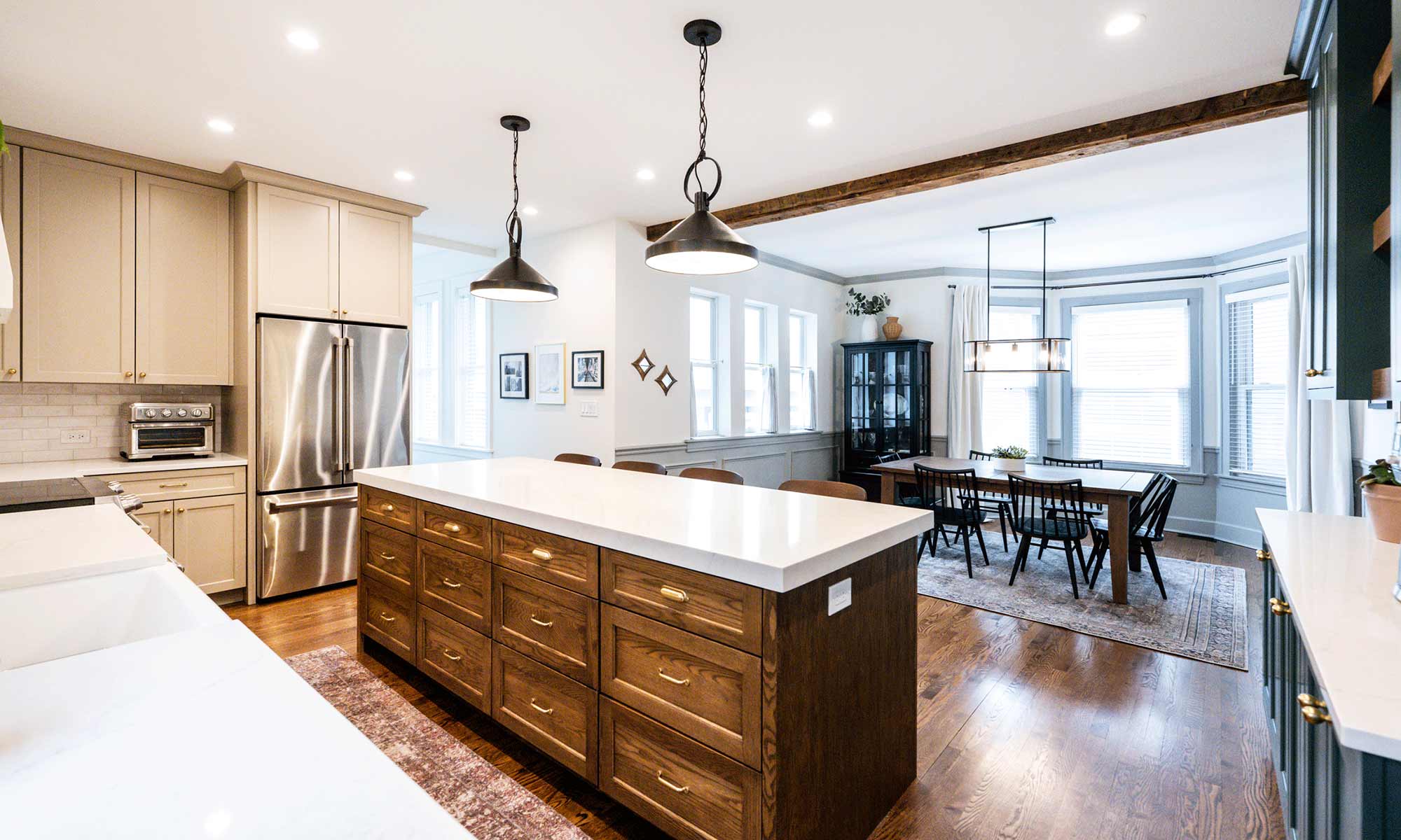 dark wood kitchen island with blue white and beige perimeter cabinetry in la grange park Illinois vintage kitchen remodel